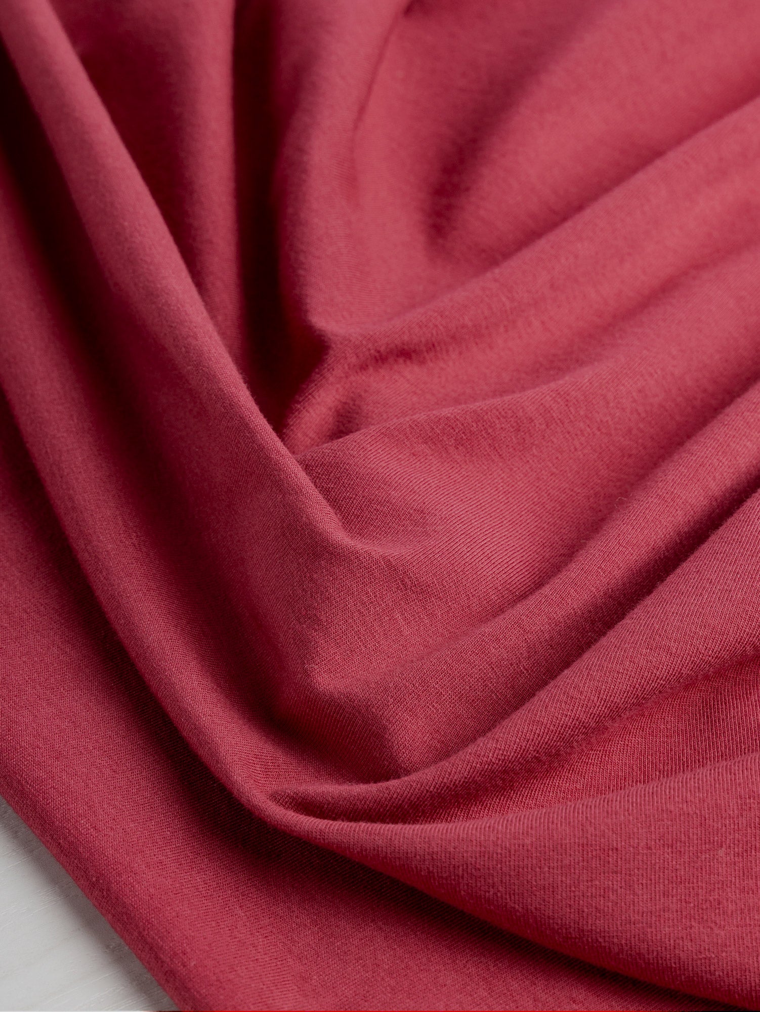 F-COT409-007 - Organic Cotton Spandex Jersey - Red Earth - Core Fabrics- scrunched.JPG