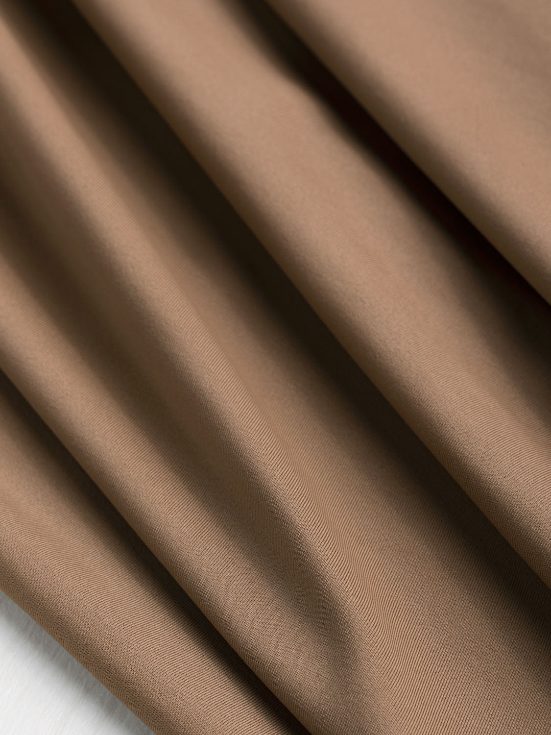 Delicate neutral beige/tan stripe muslin fabric, lightweight crepe