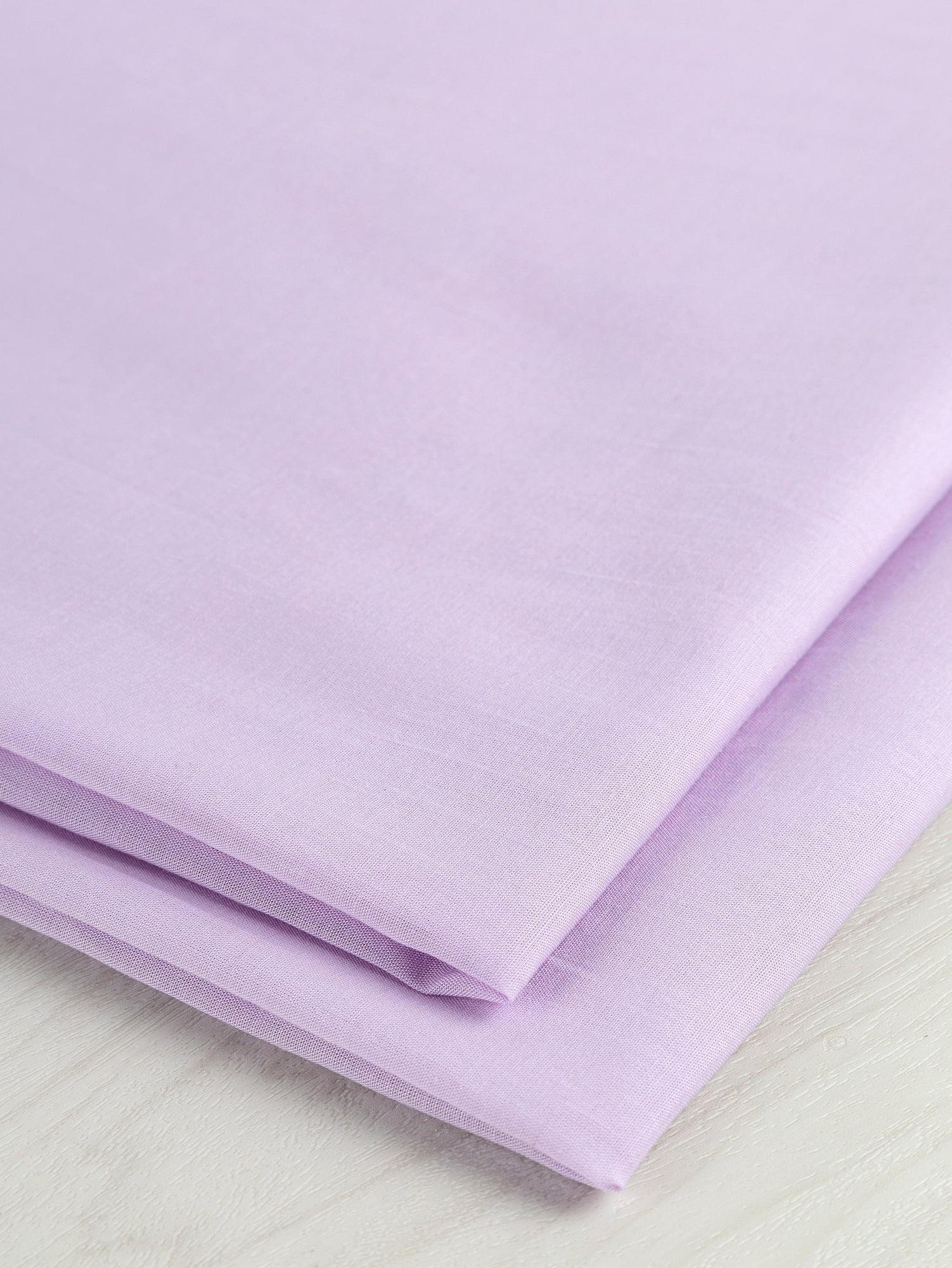 F-TEN016-002-Japanese-Tencel-Cotton-Voile-Lavender-Core-Fabrics-fold.JPG