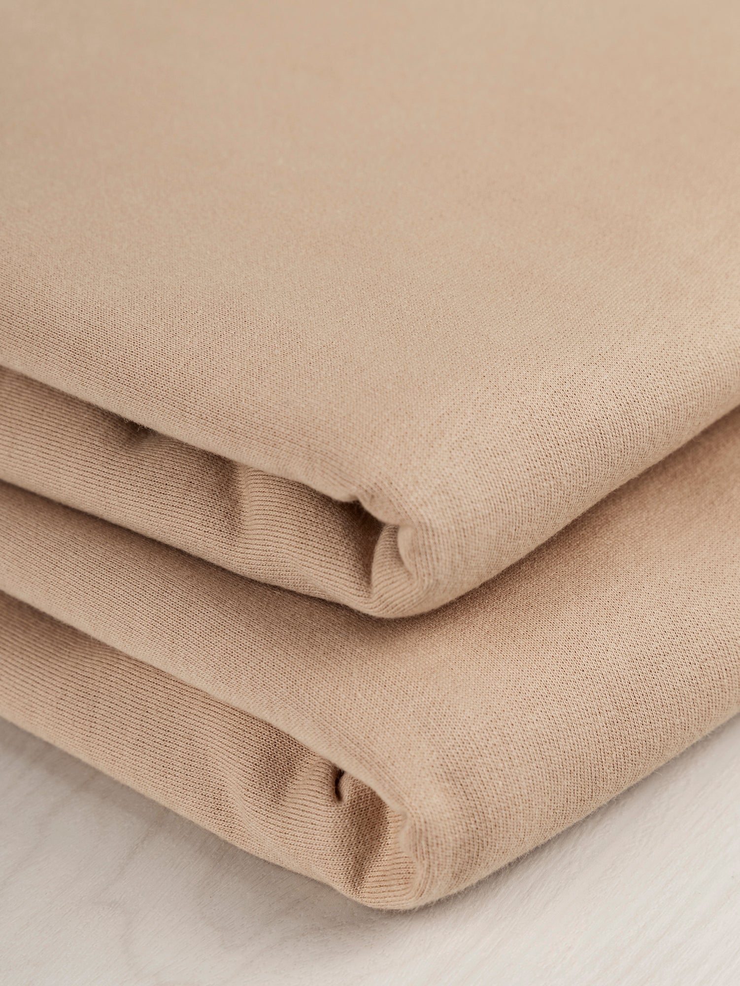 F-COT058-012-Organic-Cotton-Fleece-Beige-Core-Fabrics-fold.JPG