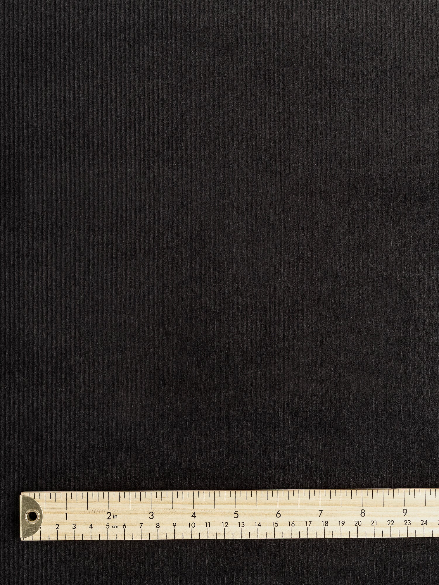 F-COT398-004-Organic-Cotton-Non-Stretch-8-Wale-Corduroy-Black-Core-Fabrics-ruler.JPG