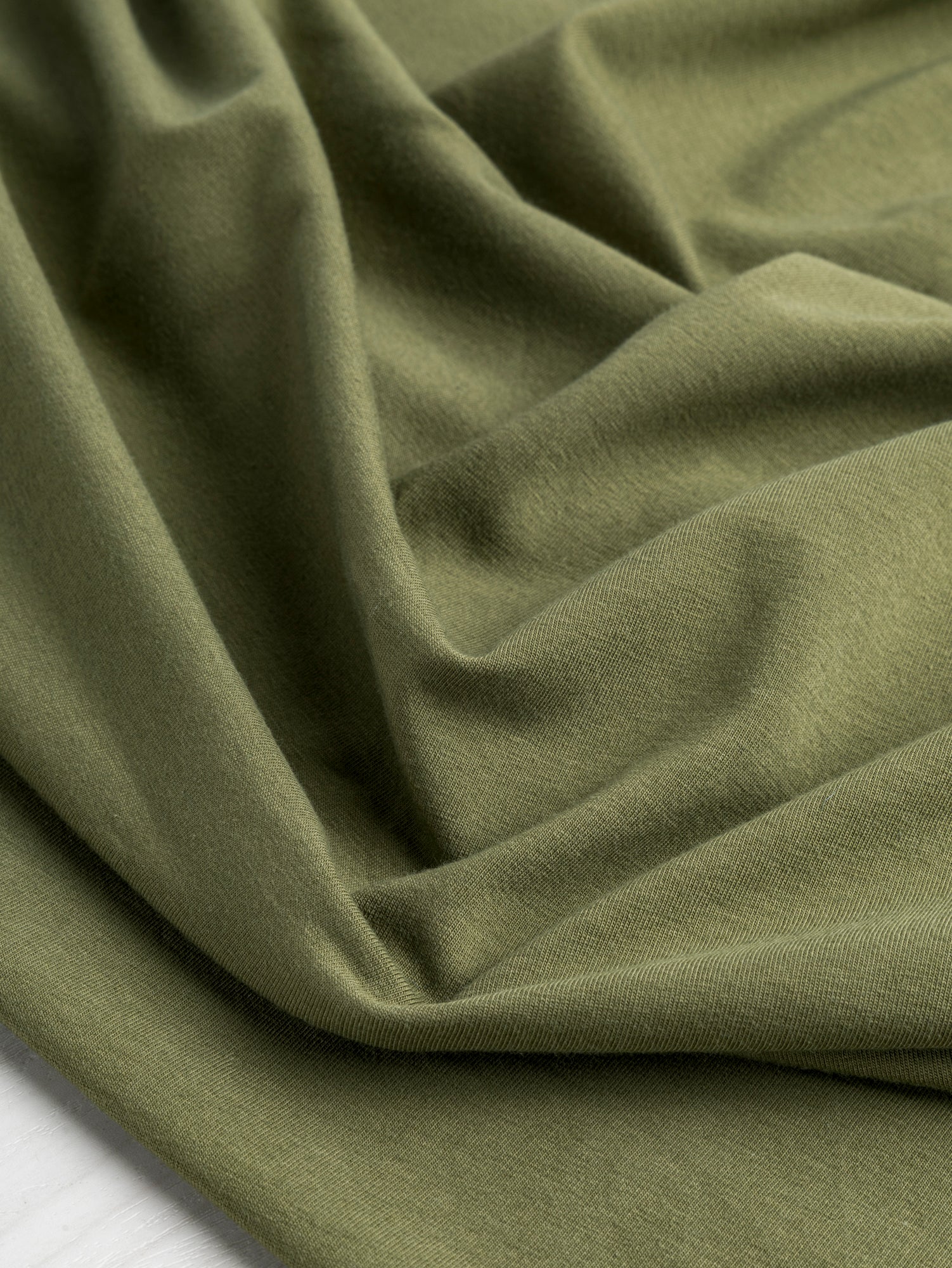 F-COT409-006 - Organic Cotton Spandex Jersey - Olive - Core Fabrics-scrunched.JPG