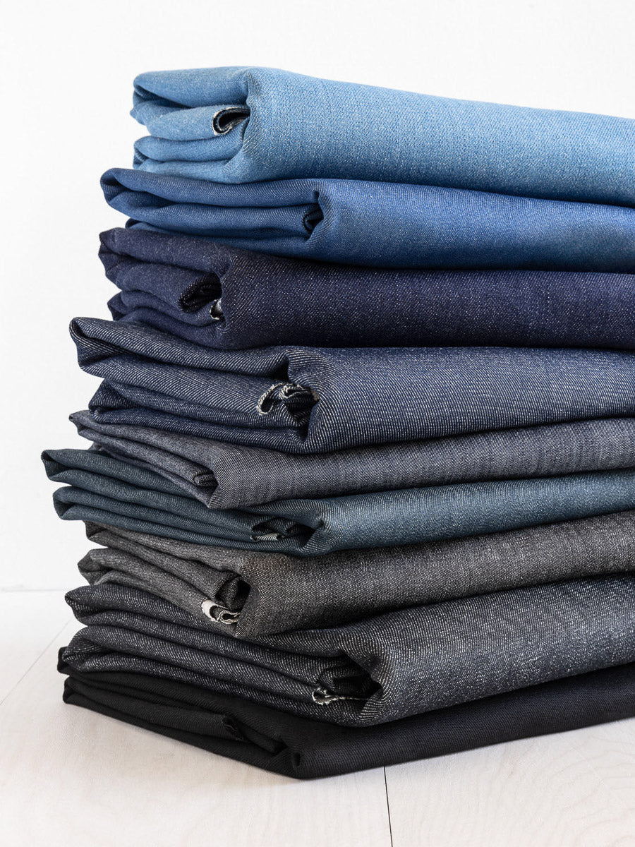 Stacks of denim fabric by the yard