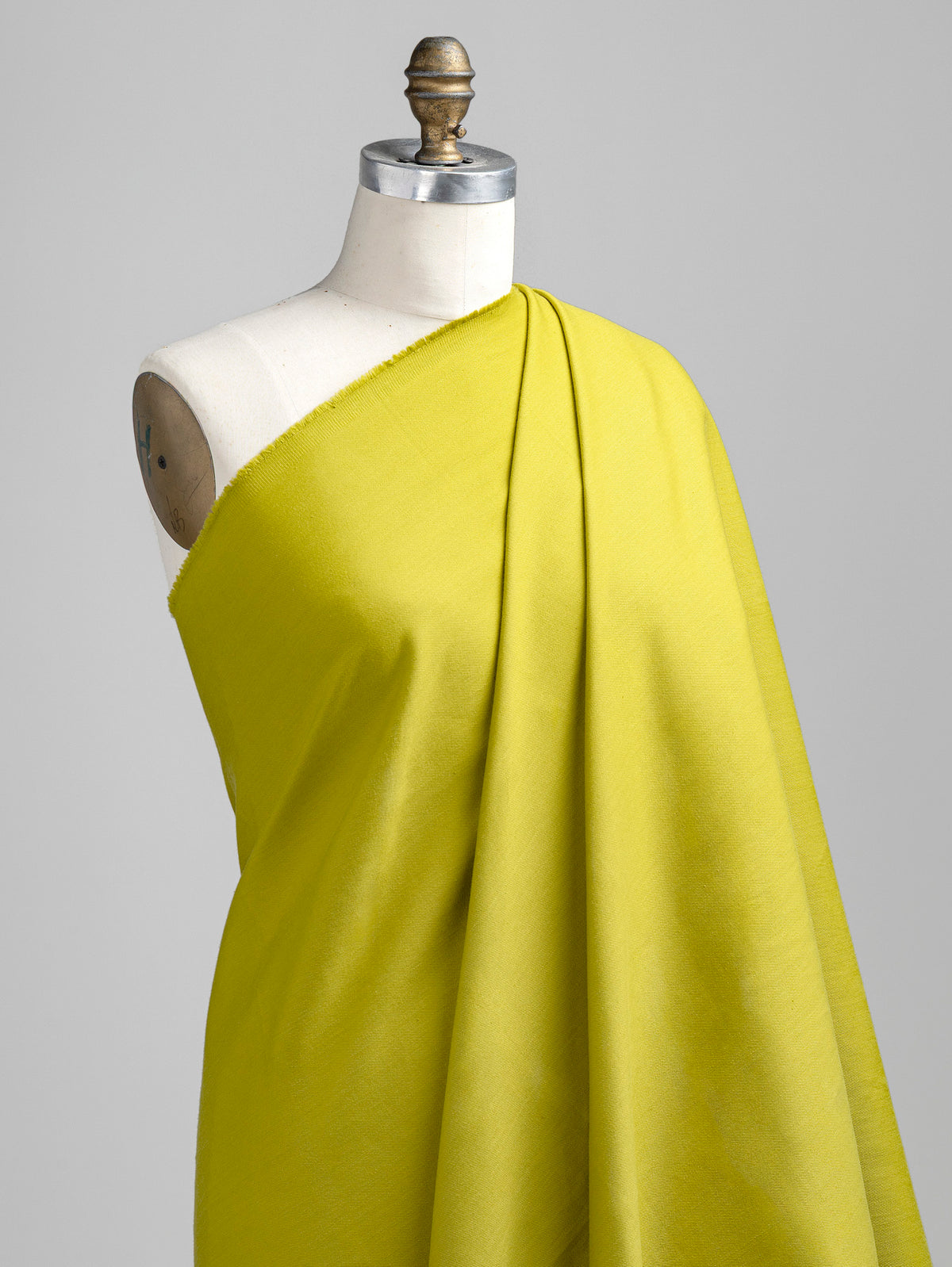 F-DEN022-013-10oz-Organic-Cotton-Stretch-Bull-Denim-Chartreuse-Core-Fabrics-draped.webp