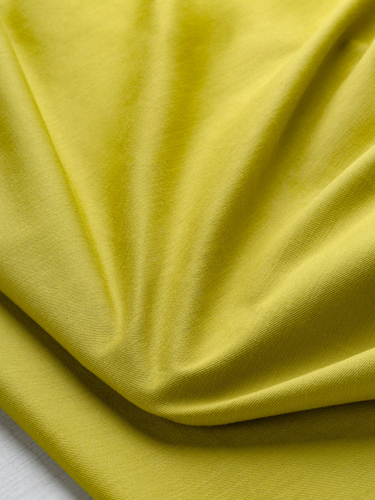 F-DEN022-013-10oz-Organic-Cotton-Stretch-Bull-Denim-Chartreuse-Core-Fabrics-scrunched.webp