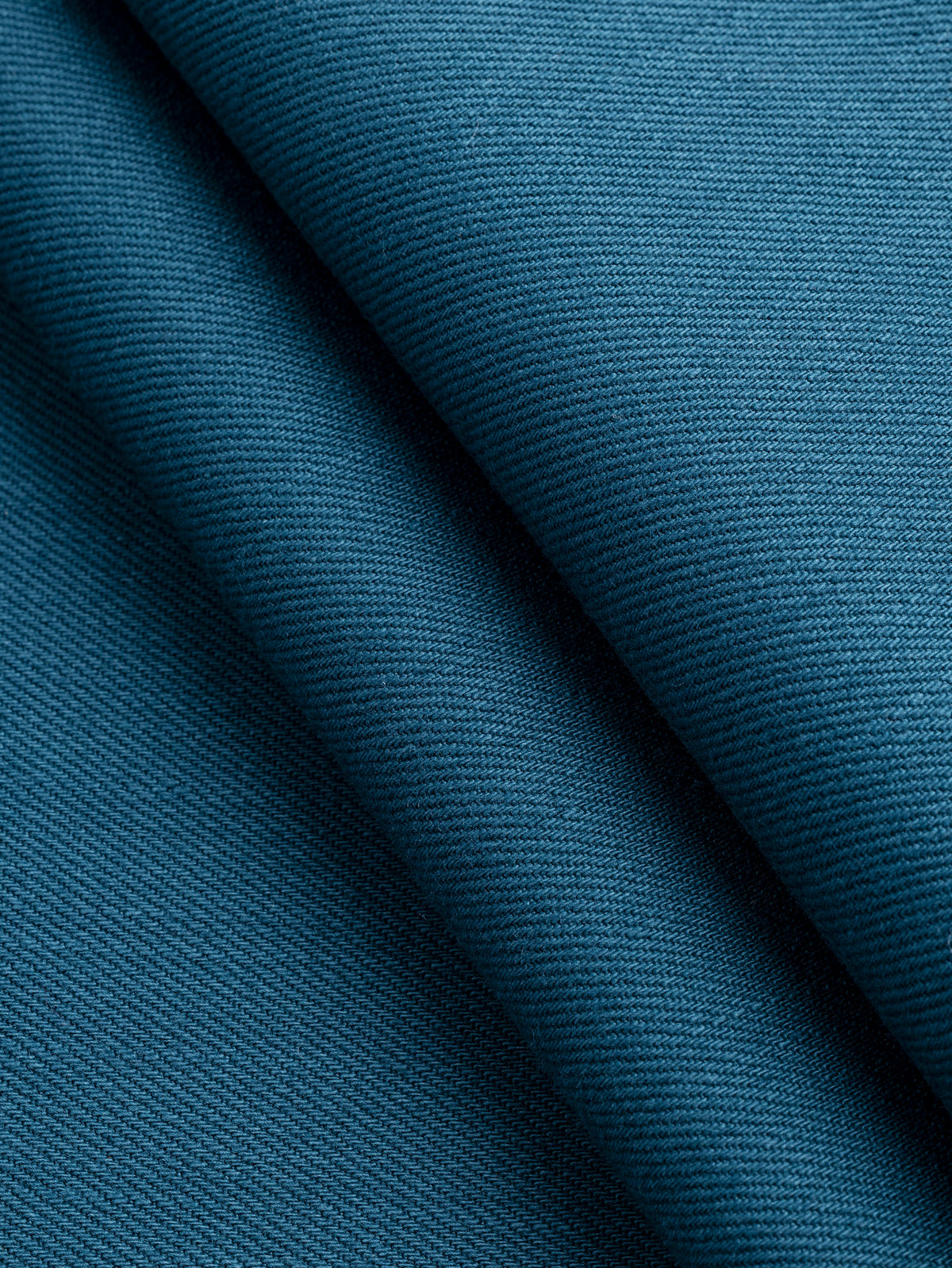 F-DEN022-009-10oz-Organic-Cotton-Stretch-Bull-Denim-Dark-Teal-Core-Fabrics-fold.webp