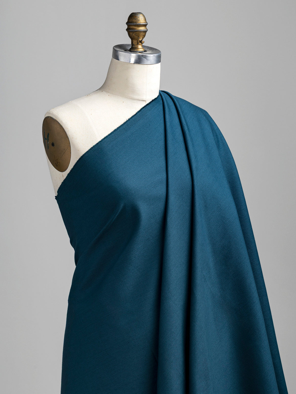 F-DEN022-009-10oz-Organic-Cotton-Stretch-Bull-Denim-Dark-Teal-Core-Fabrics-draped.webp