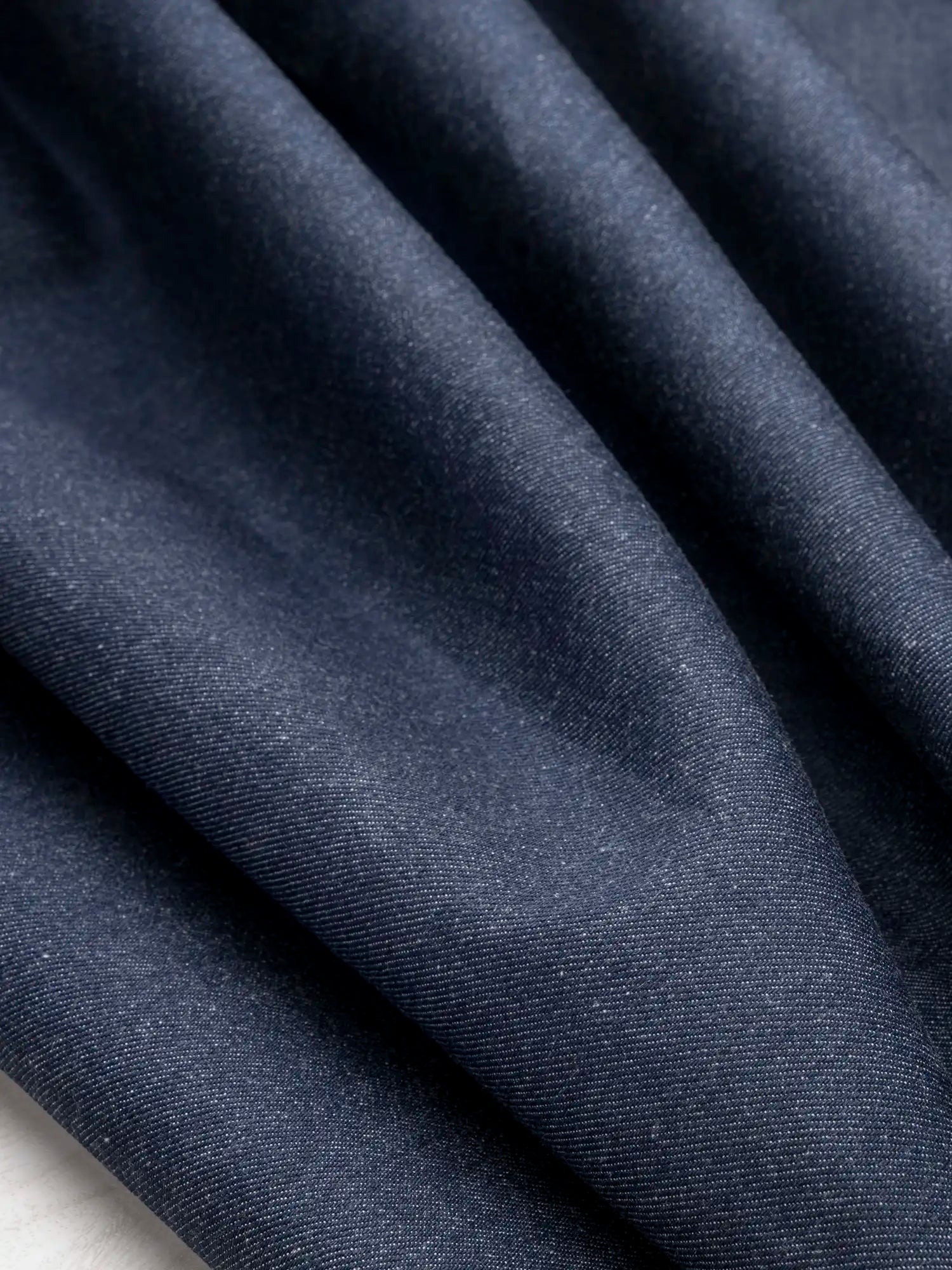 F-DEN041-11.85oz-Non-Stretch-Cotton-Tencel-Cone-Denim-Indigo-Core-Fabrics-scrunched.webp