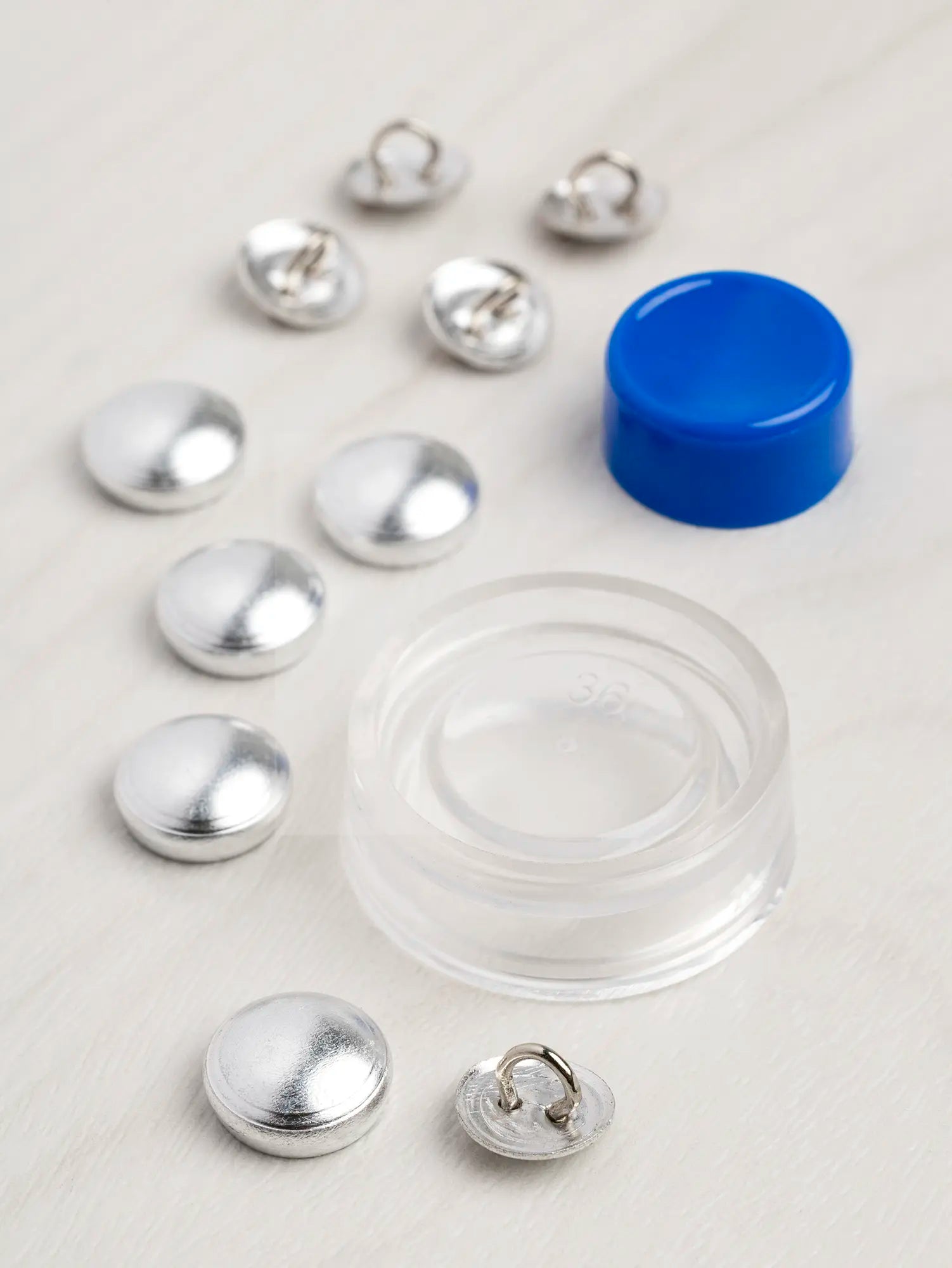  N-BUT029-12-mm-Buttons-to-Cover-Kit-Pack-of-5-Core-Fabrics-scattered.webp