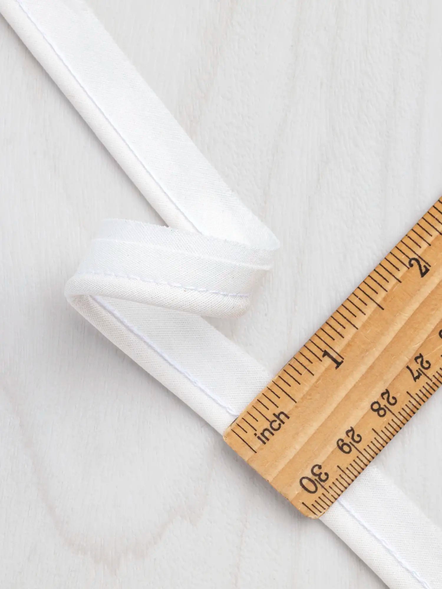 N-PIP001-002-3-mm-Cotton-Cord-Piping-Tape-Cream-Core-Fabrics-ruler.webp