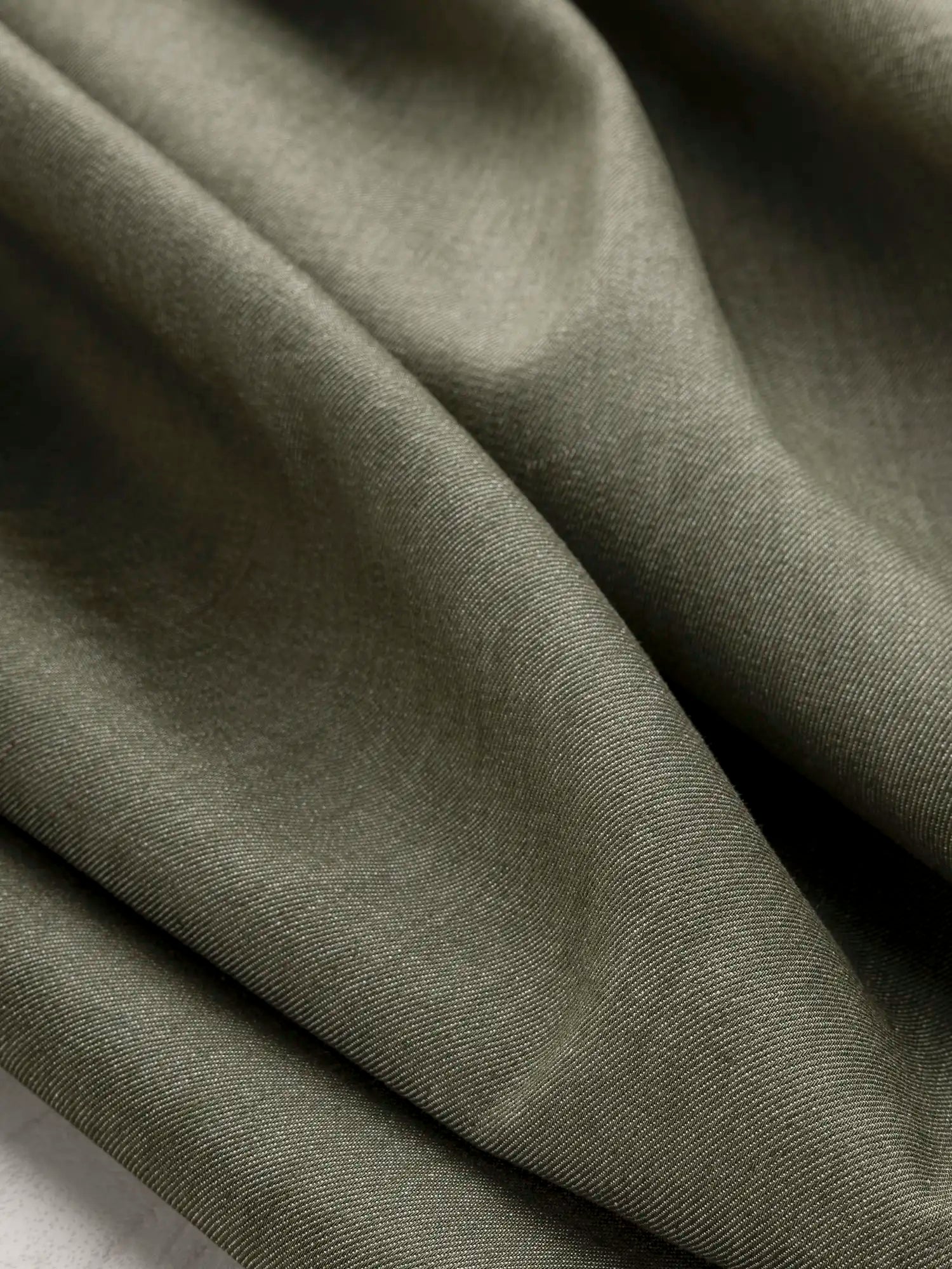 F-COT453-7-6-oz-Recycled-Cotton-Denim-Olive-Core-Fabrics-scrunched.webp