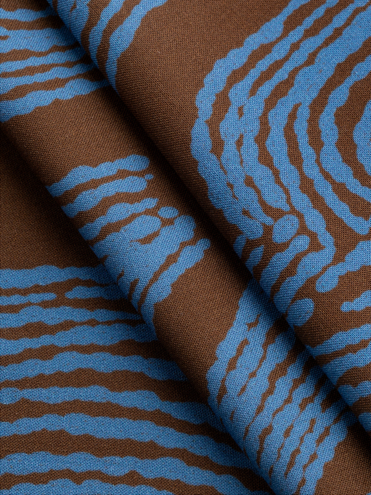 F-VIS317-Abstract-Bark-Print-Ecovero-Viscose-Toffee-and-Cerulean-Core-Fabrics-fold.webp