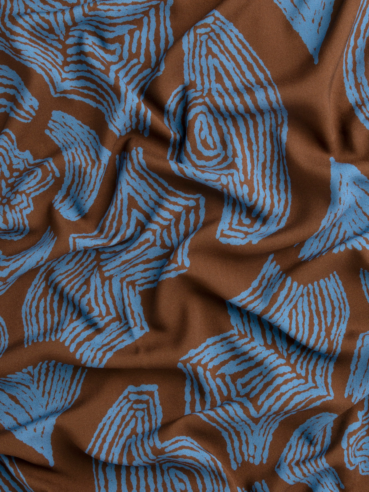 F-VIS317-Abstract-Bark-Print-Ecovero-Viscose-Toffee-and-Cerulean-Core-Fabrics-scrunched.webp