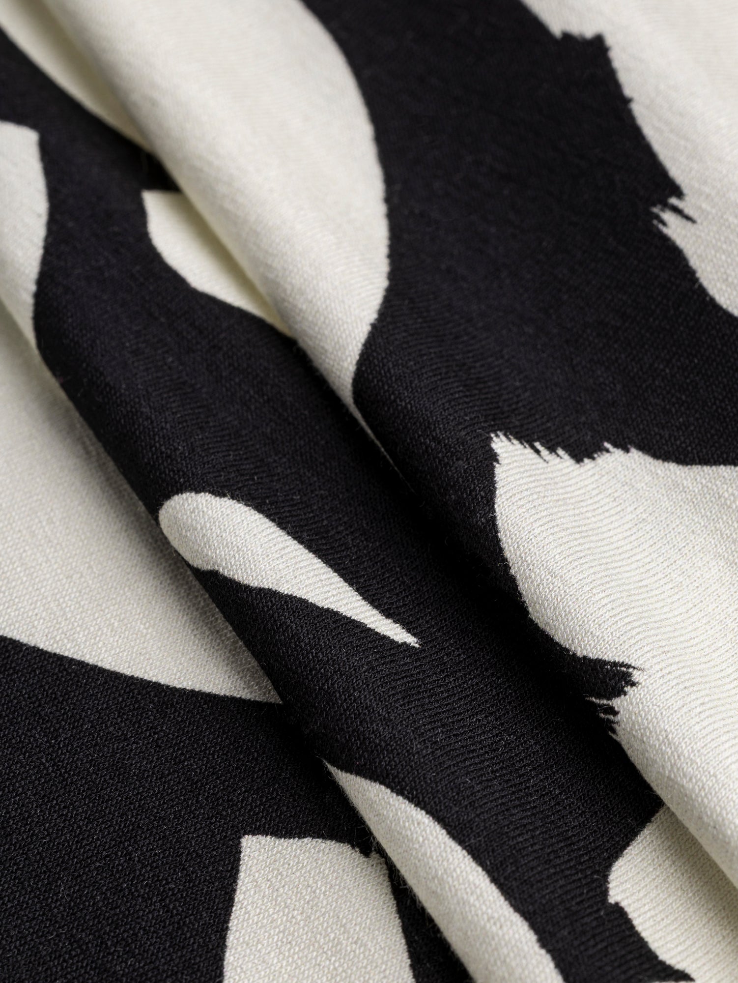 F-VIS269-Abstract-Brushstroke-Viscose-Knit-Black-Cream-Core-Fabrics-fold.JPG
