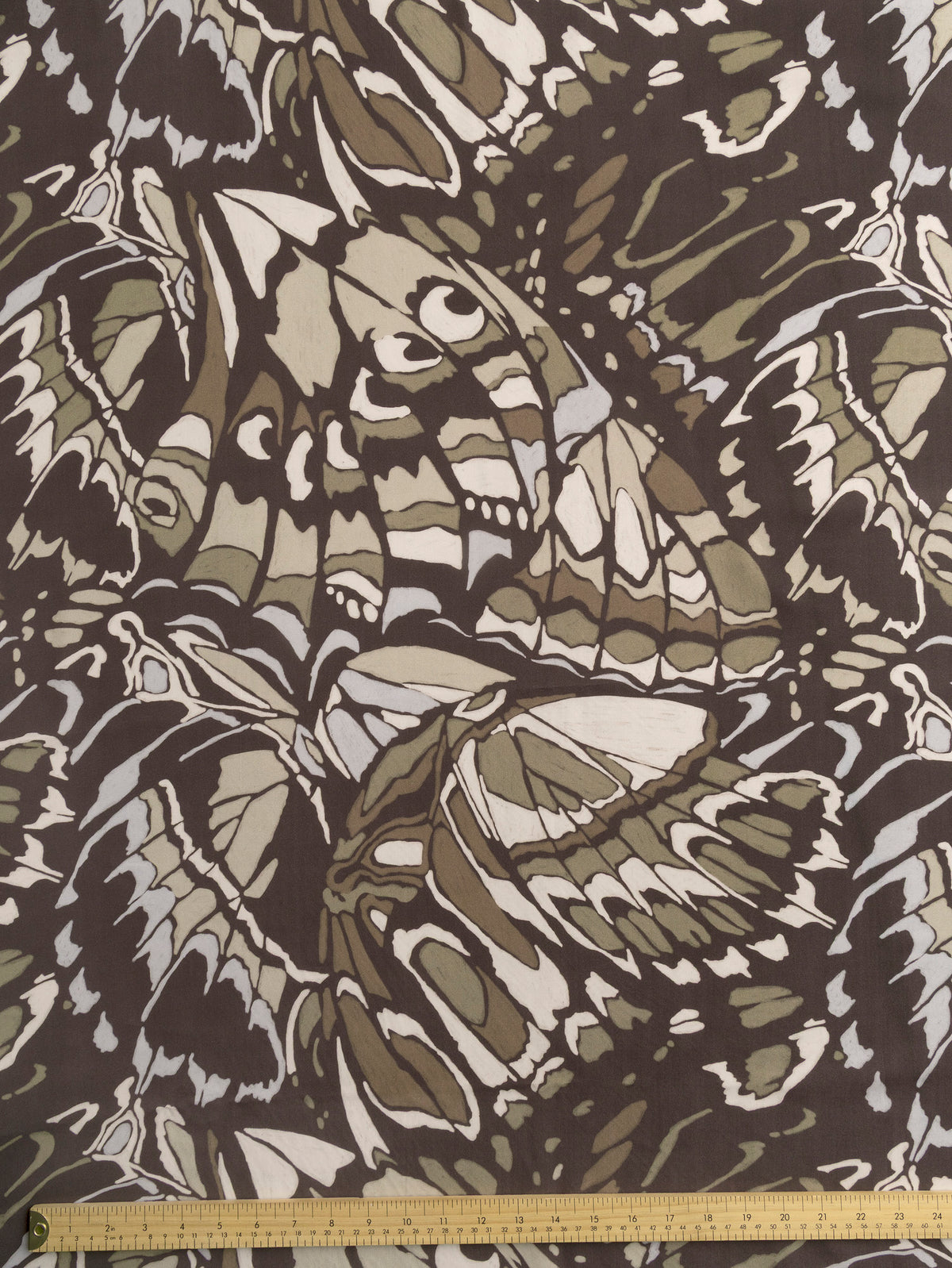 F-TEN021-Abstract-Butterfly-Print-Lyocell-Charcoal-Khaki-and-Pearl-Core-Fabrics-ruler.webp