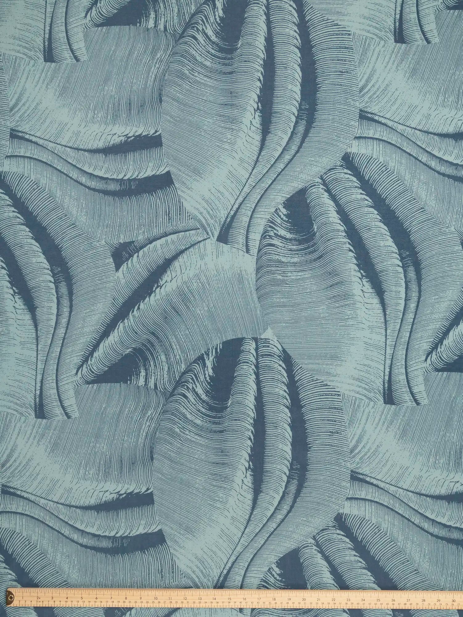 F-COT447-Abstract-Wave-Print-BCI-Cotton-Voile-Denim-and-Teal-Core-Fabrics-ruler.webp