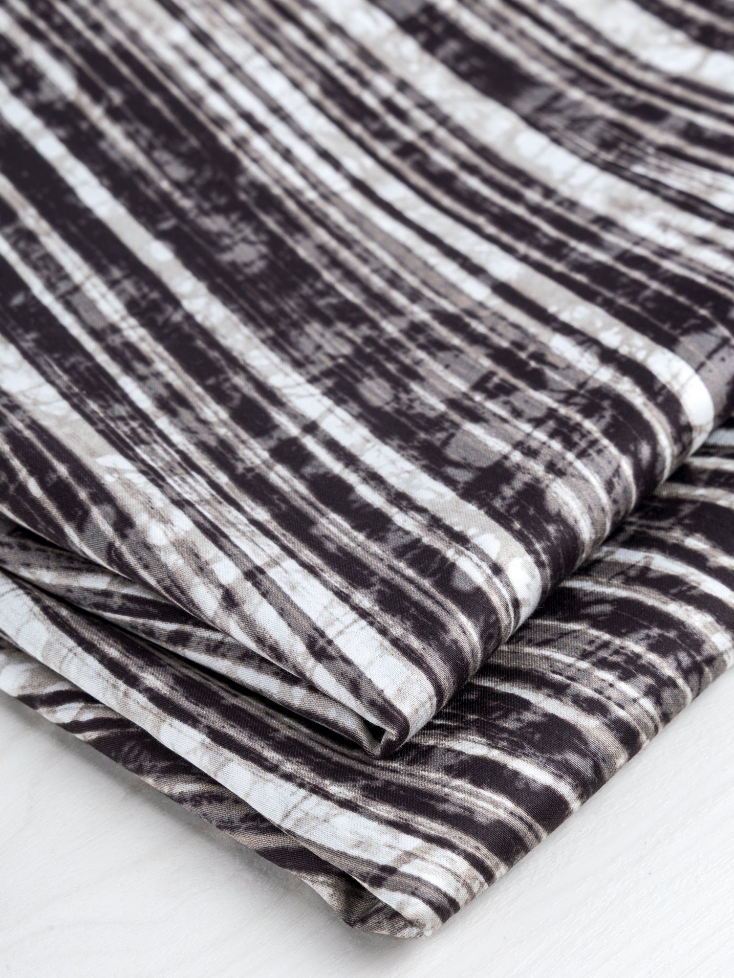 F-DEA072-Abstract-Zebra-Print-Cotton-Voile-Deadstock-Black+White-Core-Fabrics-fold.JPG