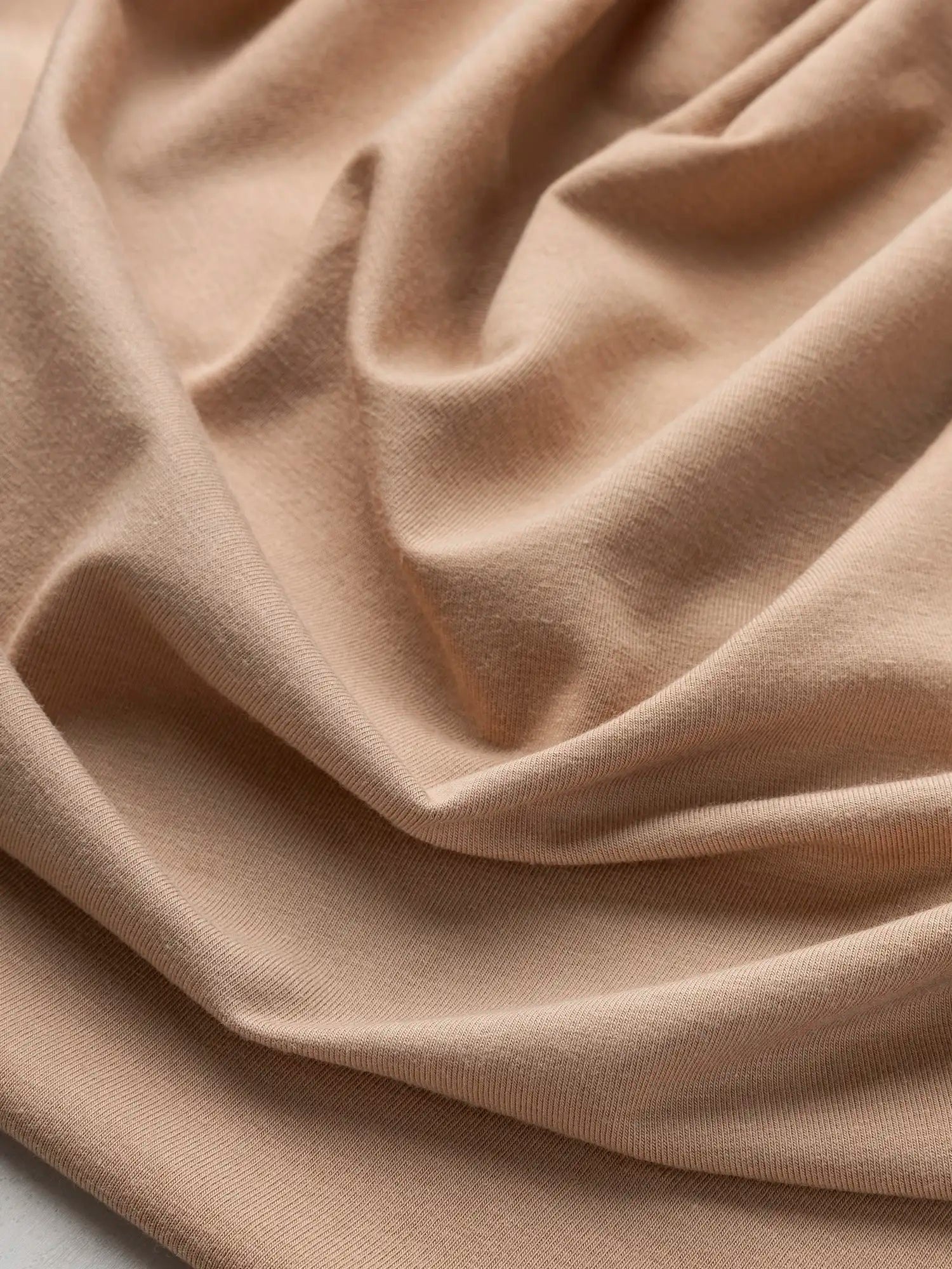F-BAM006-012-Bamboo-Organic-Cotton-Spandex-Jersey-Knit-Beige-Core-Fabrics-scrunched.webp