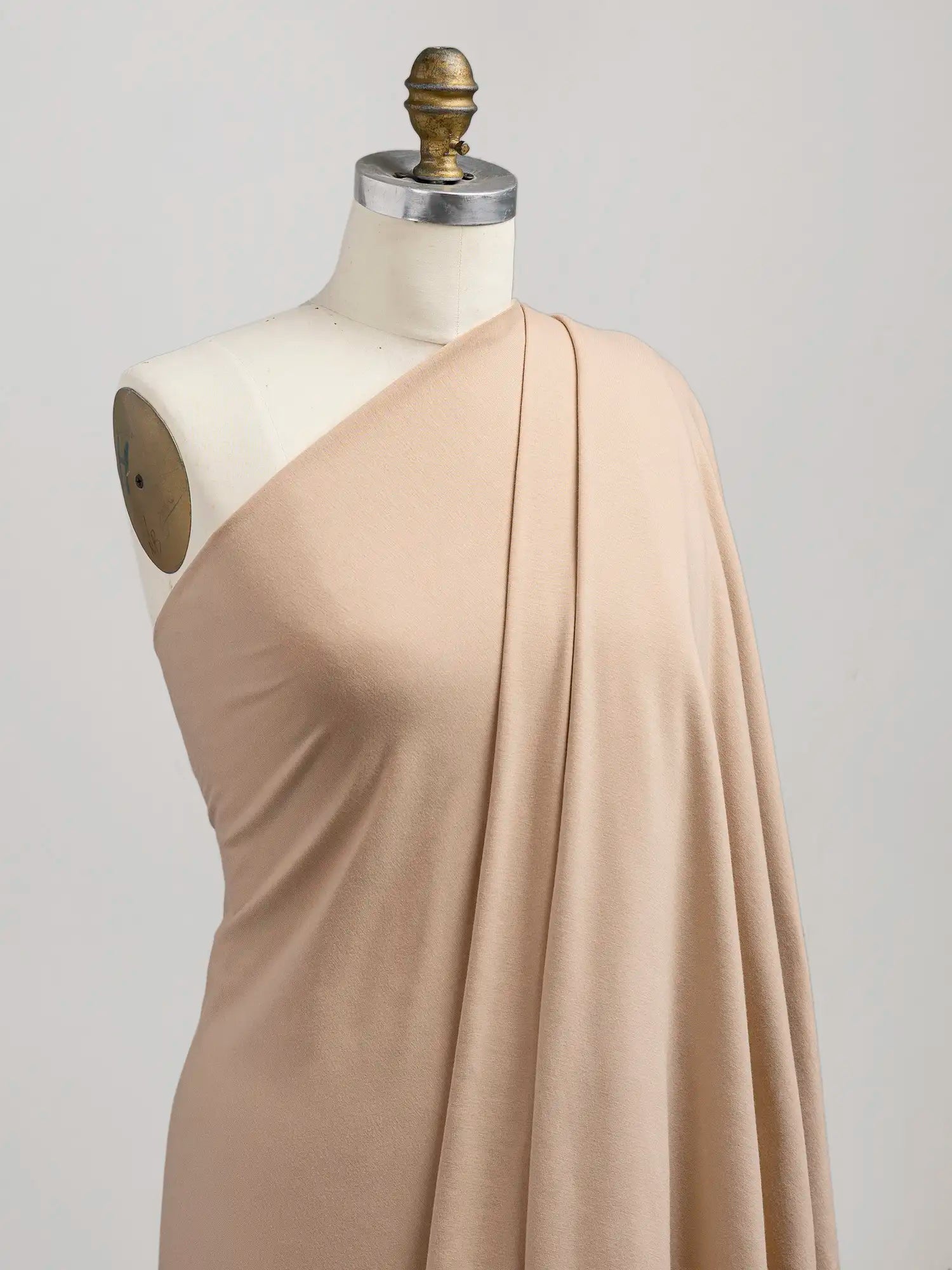 F-BAM006-012-Bamboo-Organic-Cotton-Spandex-Jersey-Knit-Beige-Core-Fabrics-draped.webp