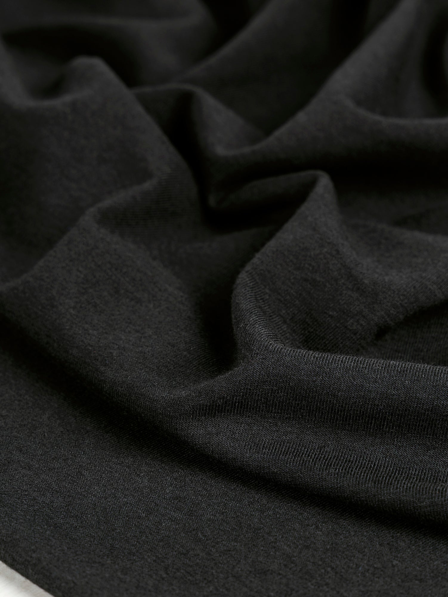 F-BAM006-001-Bamboo-Organic-Cotton-Spandex-Jersey-Knit-Black-Core-Fabrics-scrunched.JPG