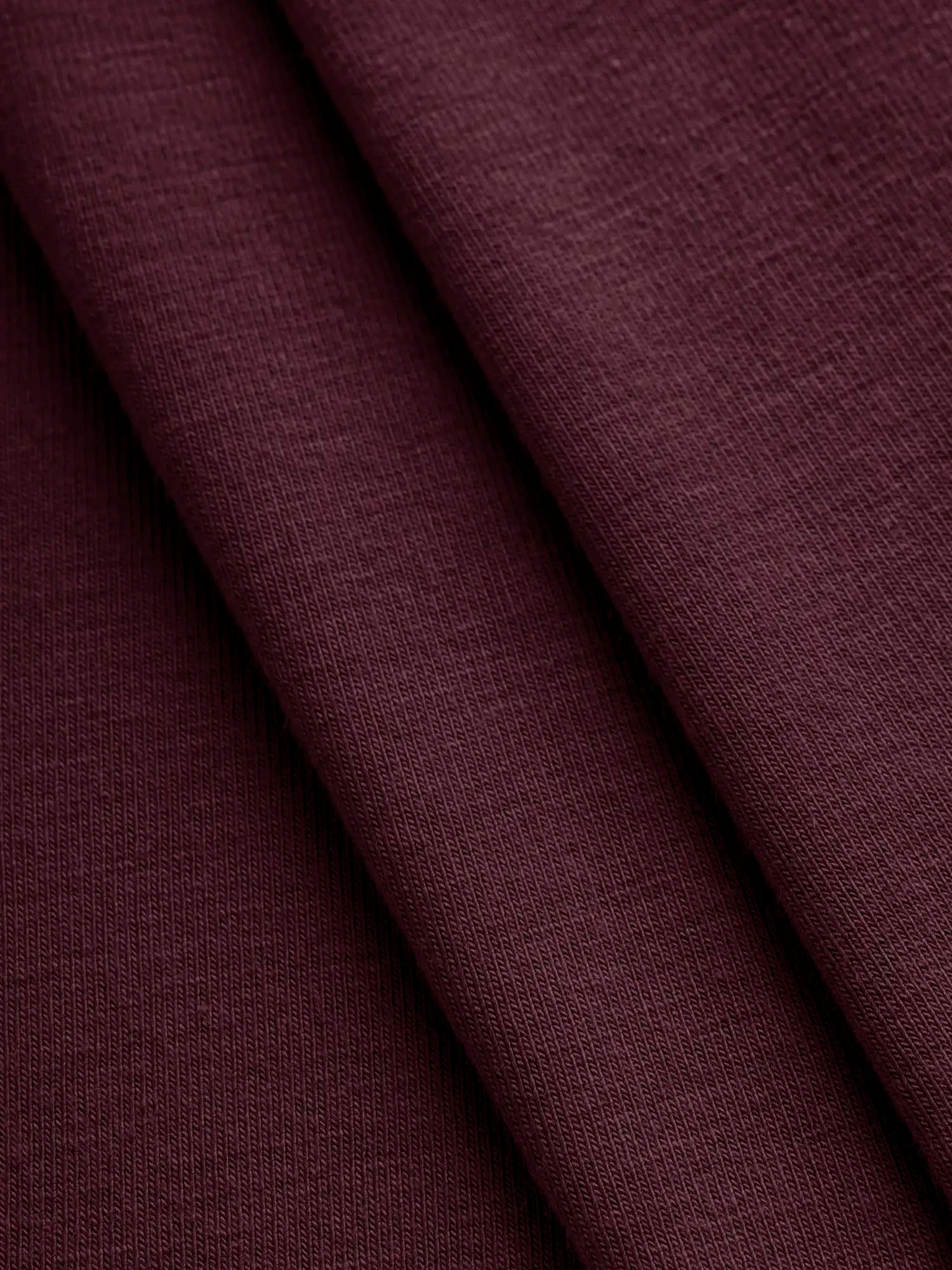 F-BAM006-014-Bamboo-Organic-Cotton-Spandex-Jersey-Knit-Bordeaux-Core-Fabrics-fold.webp