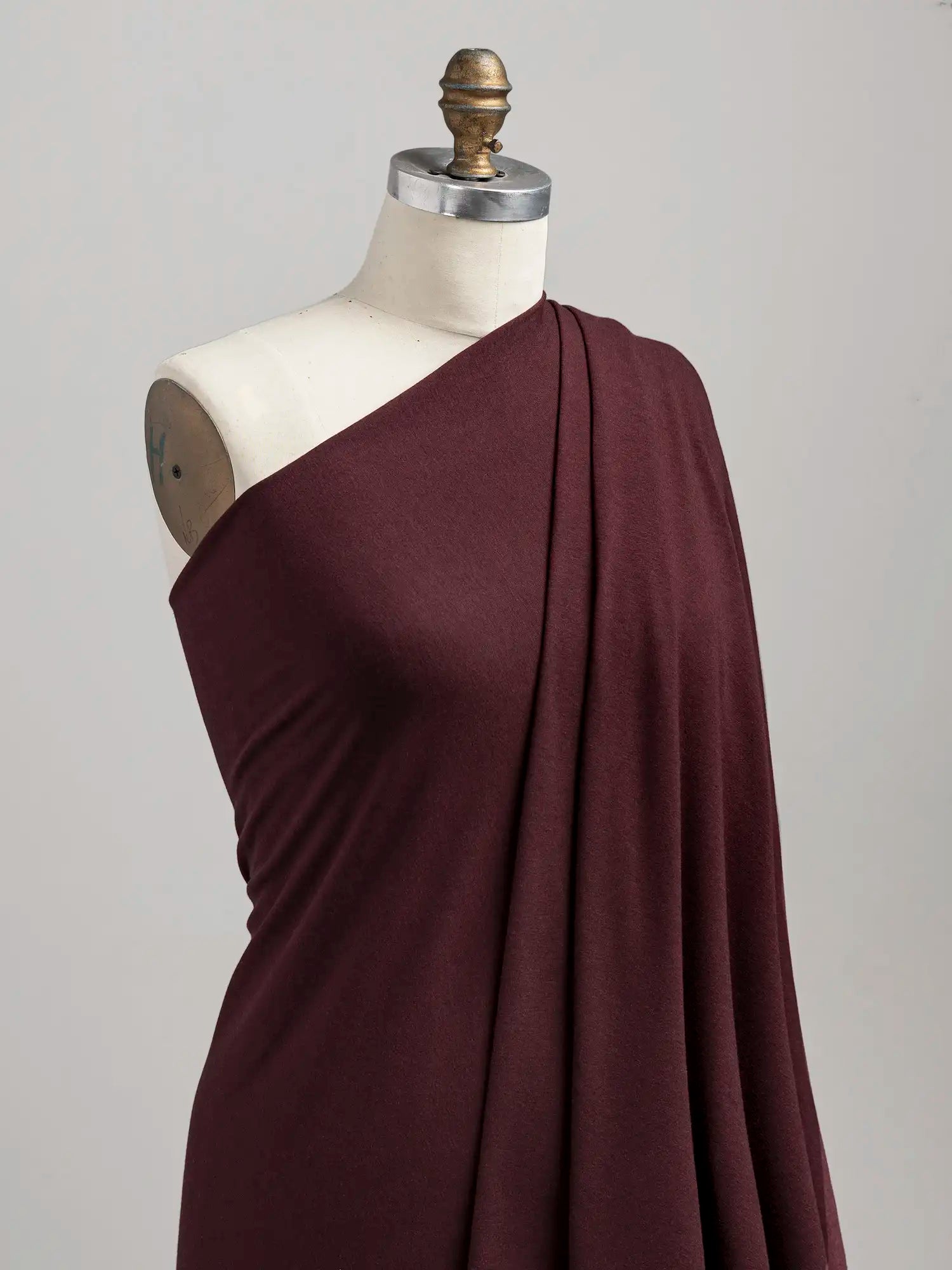 F-BAM006-014-Bamboo-Organic-Cotton-Spandex-Jersey-Knit-Bordeaux-Core-Fabrics-draped.webp
