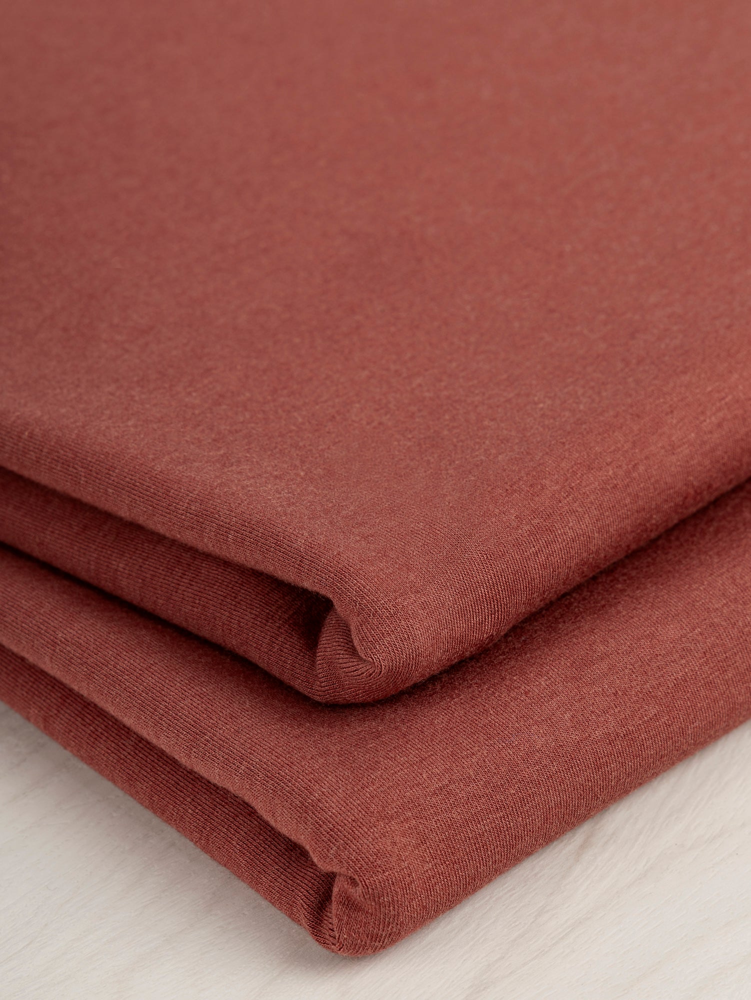 F-BAM006-019-Bamboo-Organic-Cotton-Spandex-Jersey-Knit-Mahogany-Core-Fabrics-fold.JPG