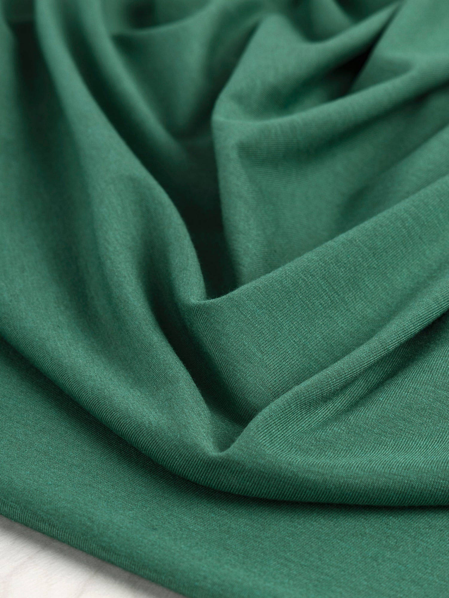 F-BAM006-020-Bamboo-Organic-Cotton-Spandex-Jersey-Knit-Pine-Green-Core-Fabrics-scrunched.JPG