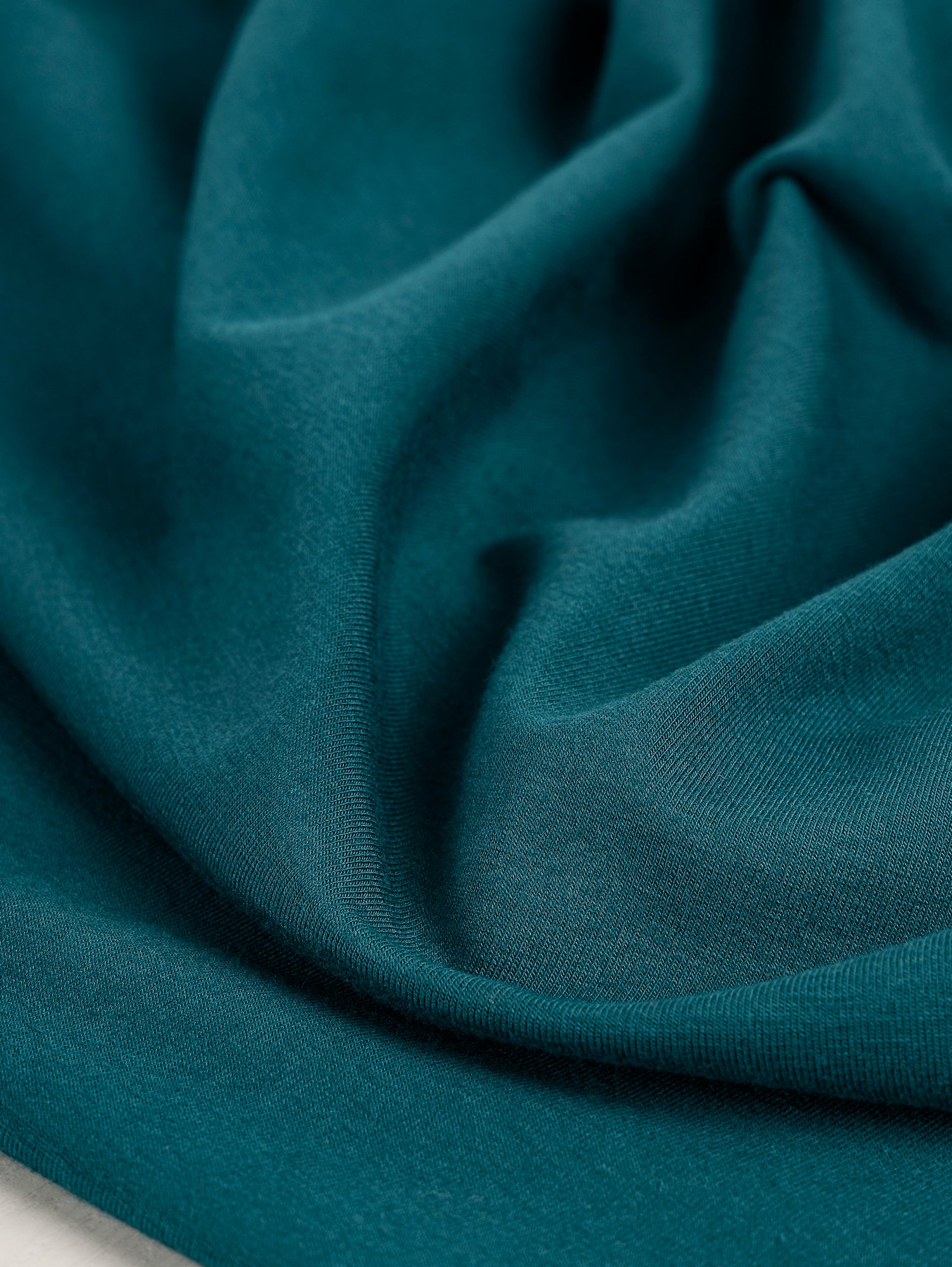 F-BAM006-021-Bamboo-Organic-Cotton-Spandex-Jersey-Knit-Teal-Core-Fabrics-scrunched.JPG