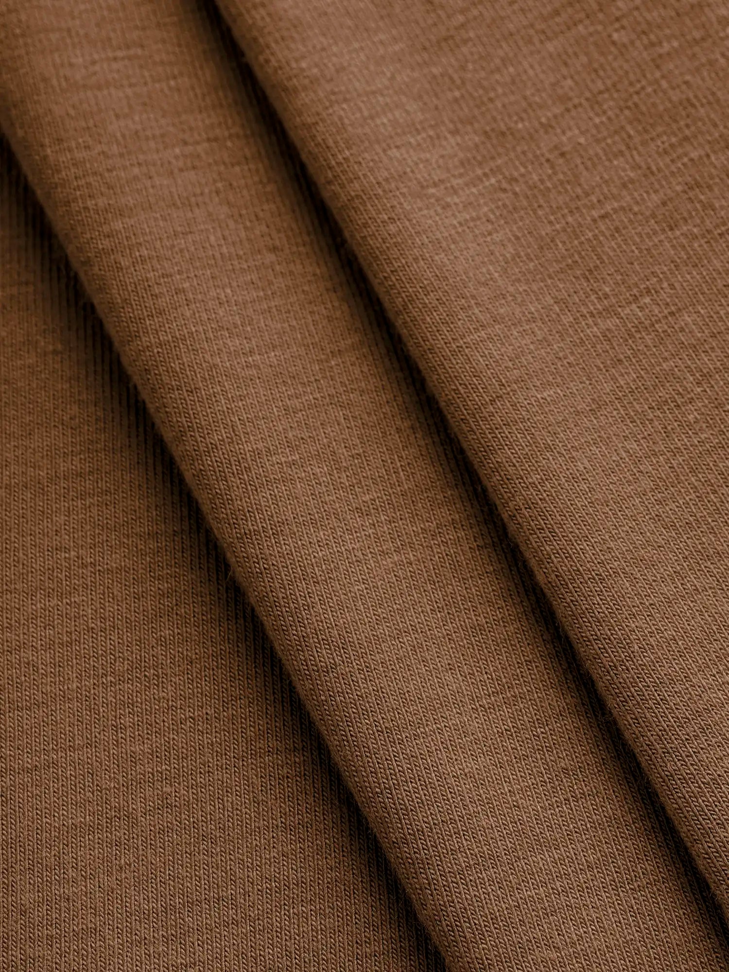 F-BAM006-024-Bamboo-Organic-Cotton-Spandex-Jersey-Knit-Toffee-Core-Fabrics-fold.webp