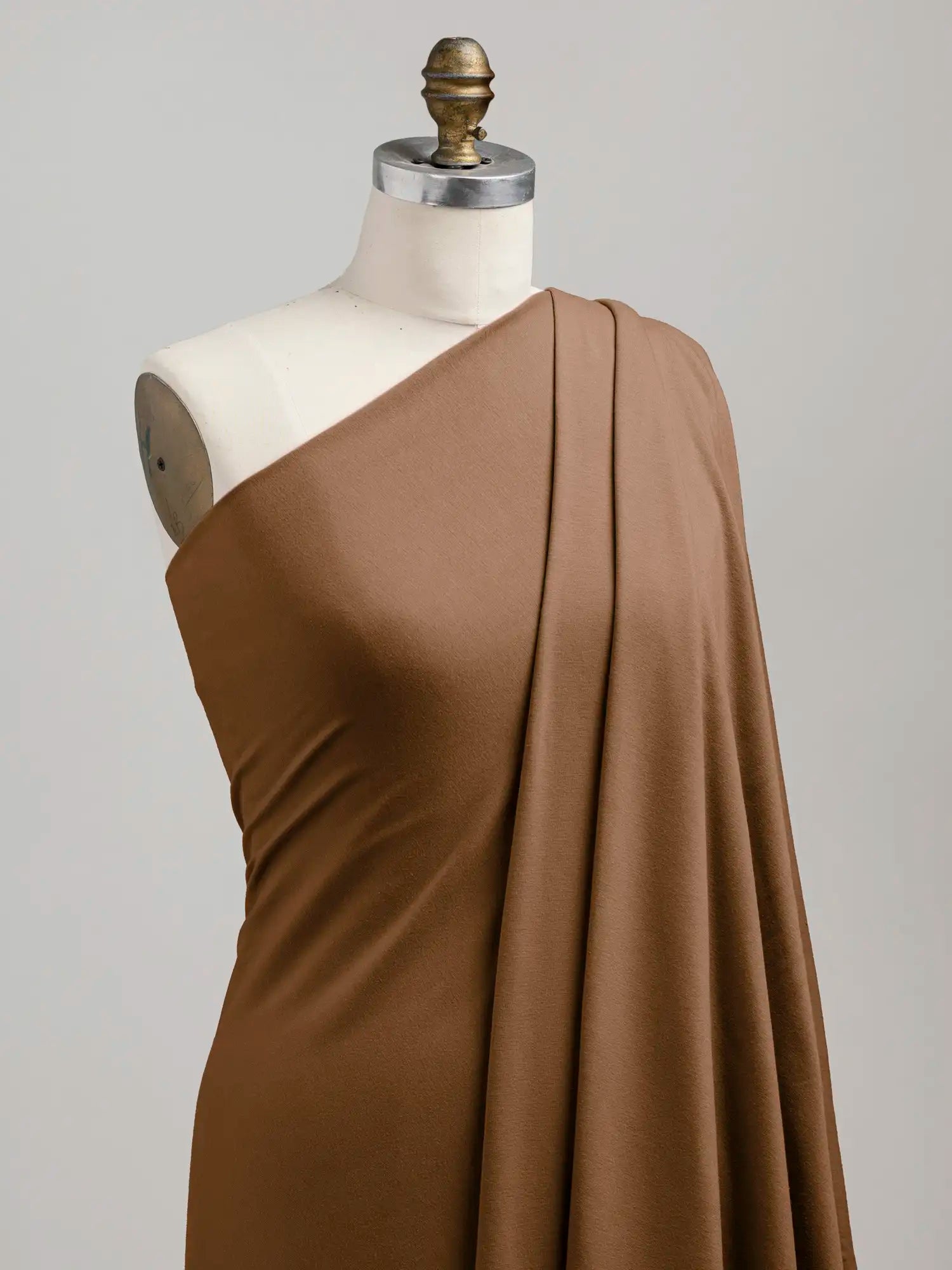 F-BAM006-024-Bamboo-Organic-Cotton-Spandex-Jersey-Knit-Toffee-Core-Fabrics-draped.webp