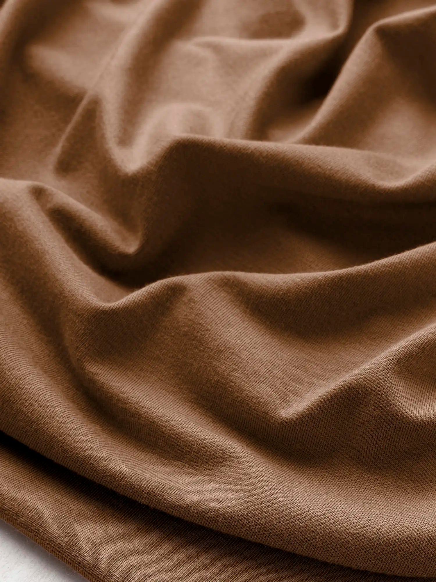 F-BAM006-024-Bamboo-Organic-Cotton-Spandex-Jersey-Knit-Toffee-Core-Fabrics-scrunched.webp