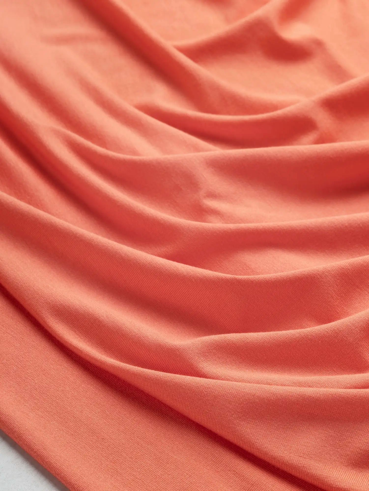 F-DEA249-Bamboo-Rayon-Spandex-Stretch-Knit-Deadstock-Coral-Core-Fabrics-scrunched.webp