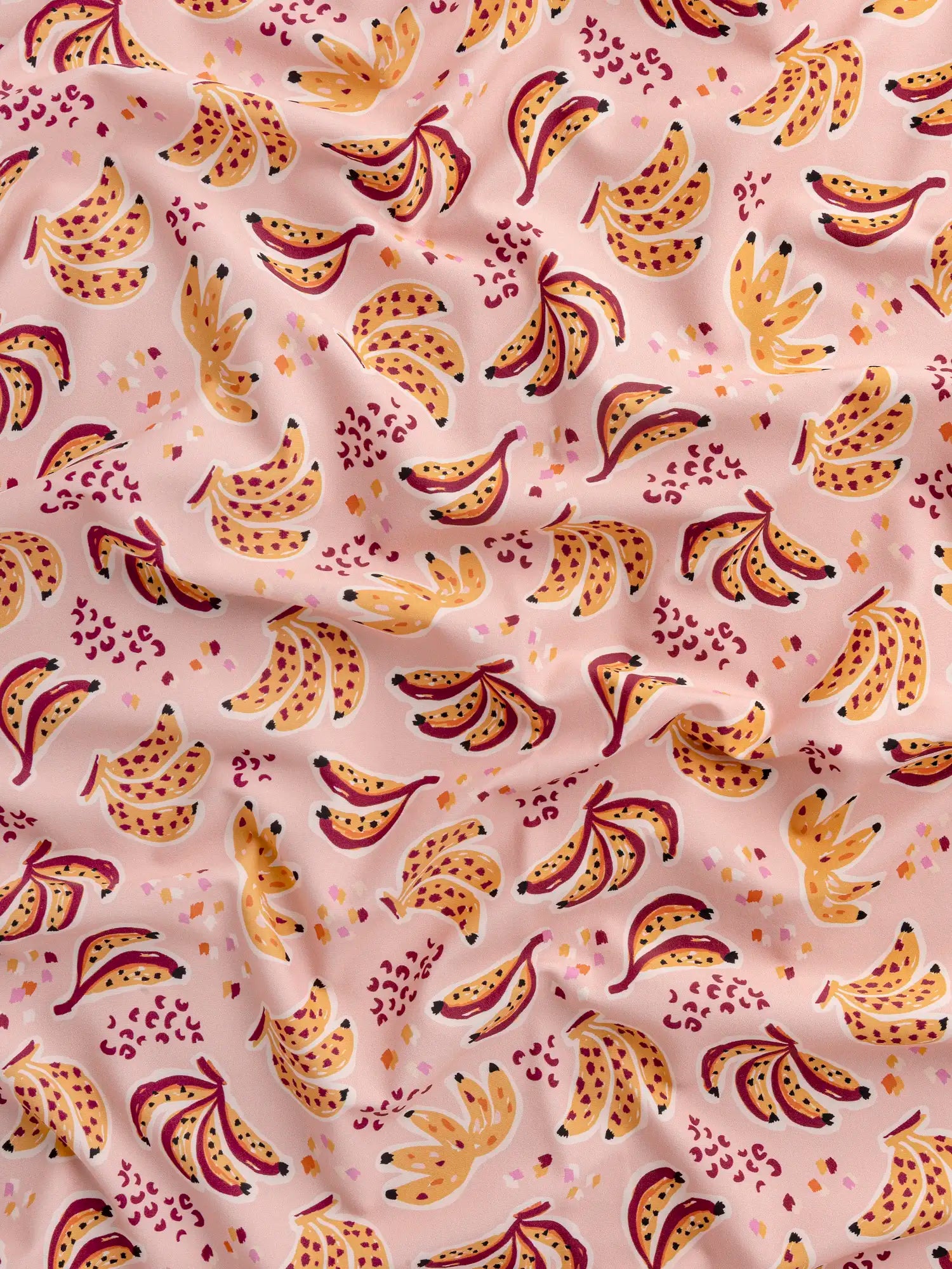 F-NYL021-Banana-Split-Print-Swim-Performance-Knit-Pink-and-Multicolour-Core-Fabrics-scrunched.webp