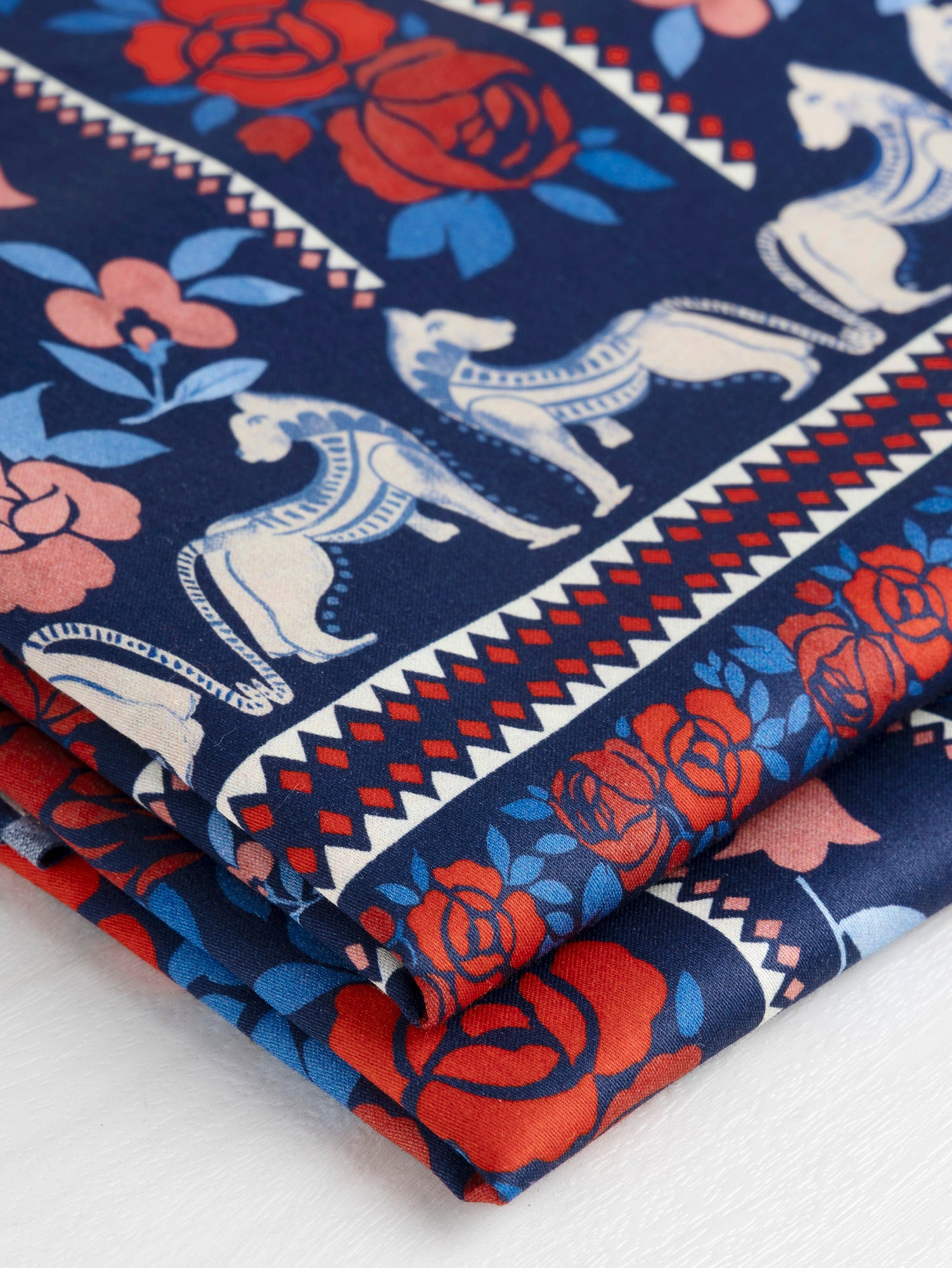 F-COT332-Band-Of-Roses-Panel-Print-Cotton-Lawn-Navy-Red-Core-Fabrics-fold.JPG