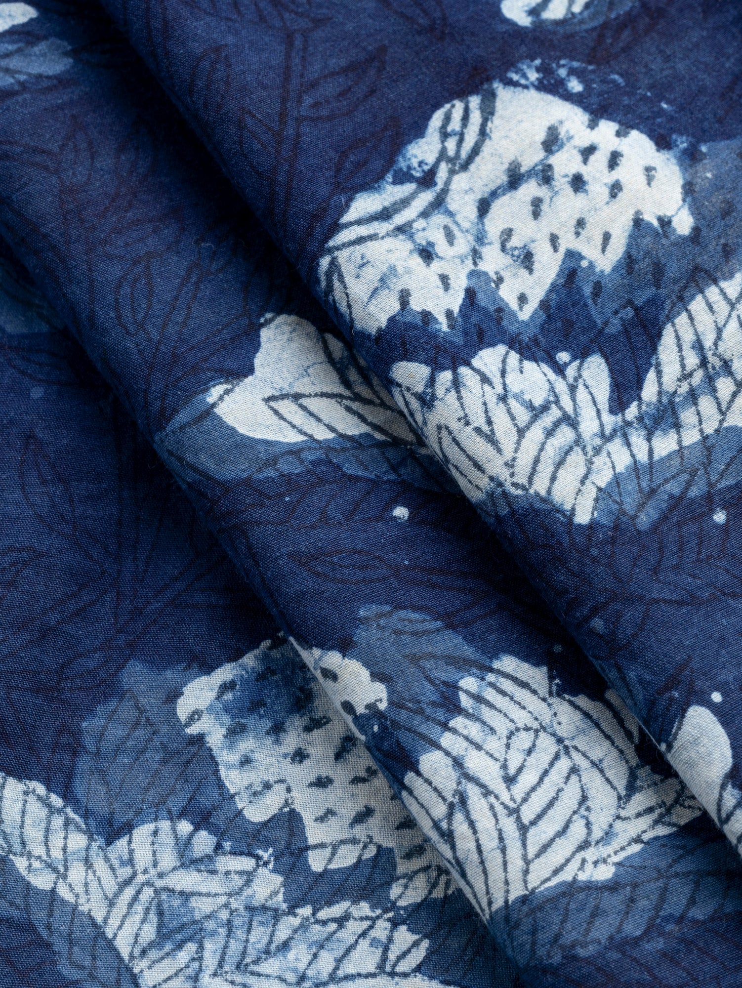 F-COT491-Beautifully-Imperfect-Strawberry-Flower-Block-Print-Cotton-Poplin-Indigo+Chambray-Core-Fabrics-fold.JPG
