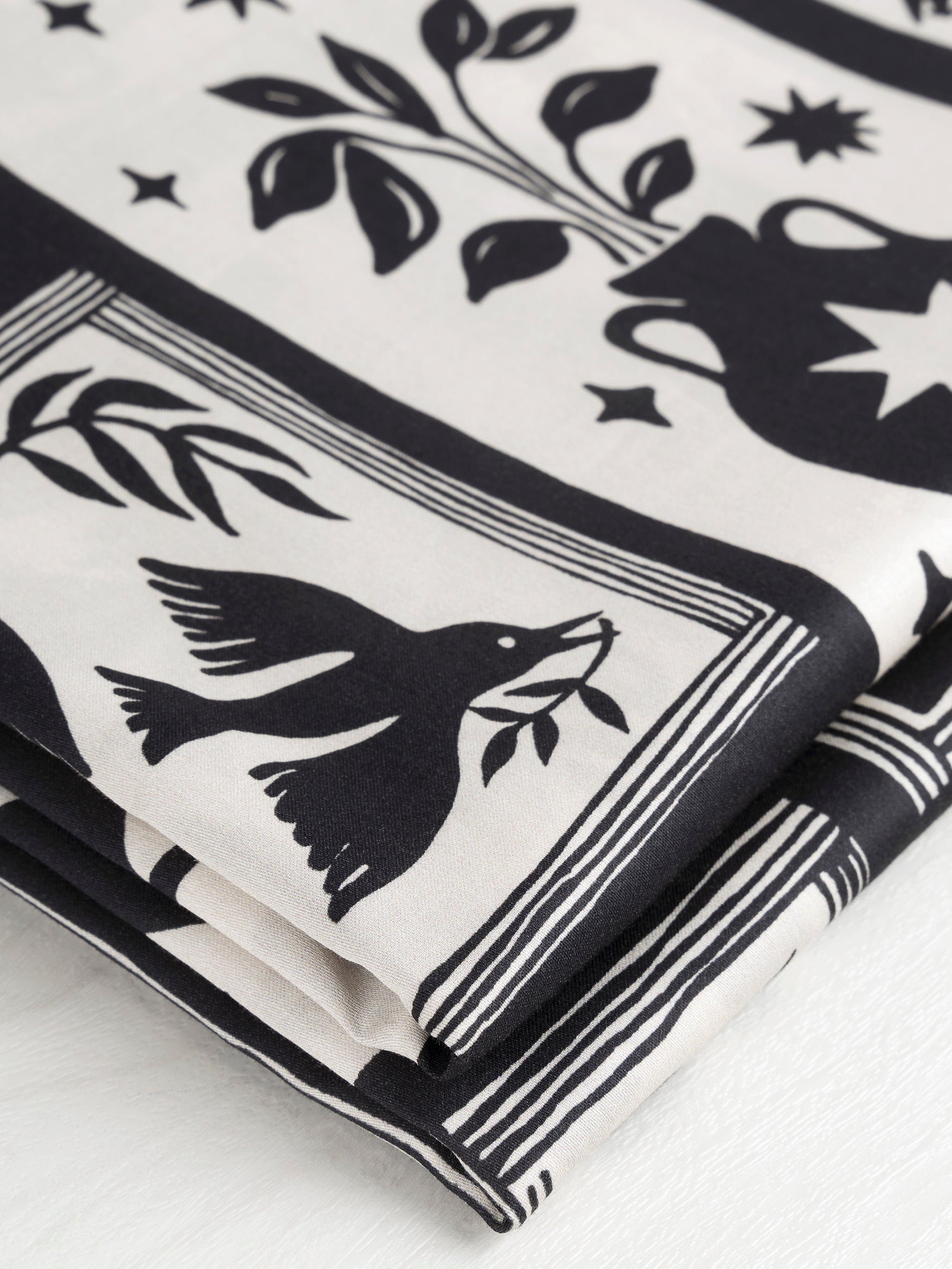 F-COT330-Birds-and-Vases-Gallery-Print-Cotton-Lawn-Black-and-Cream-Core-Fabrics-fold.JPG