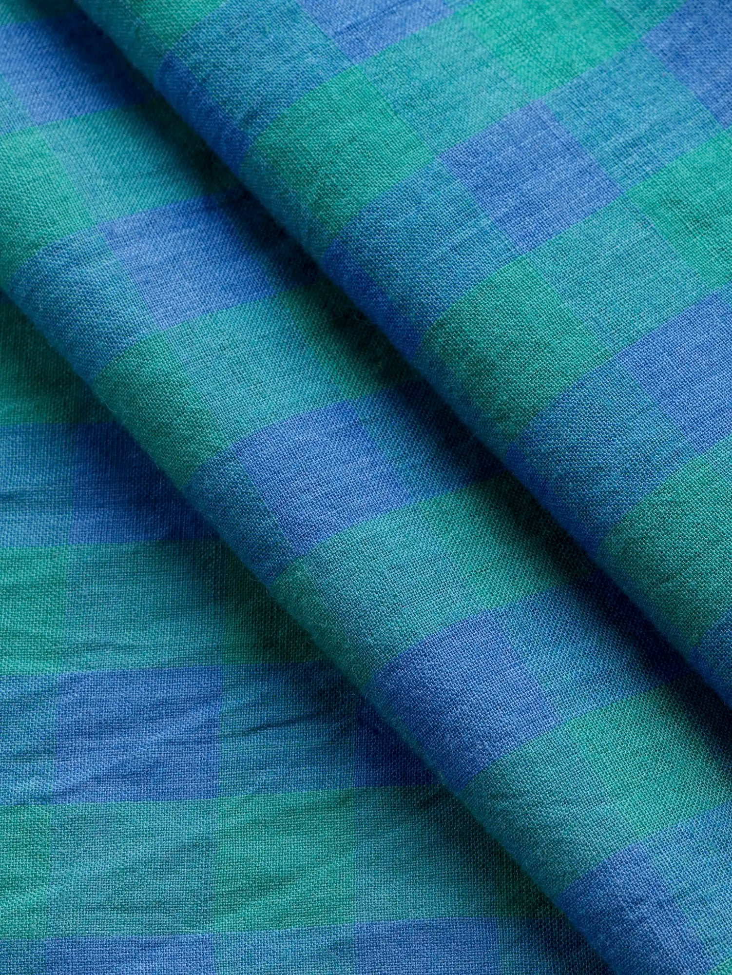 F-COT373-003-Blue-Moon-Handwoven-Gingham-Cotton-Emerald-and-Periwinkle-Core-Fabrics-fold.webp