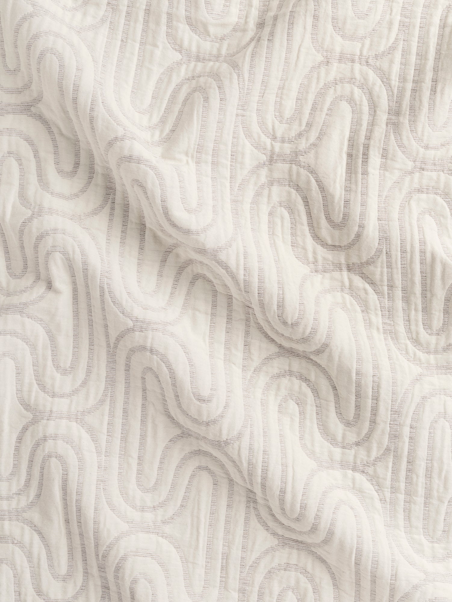 F-JAC026-Boho-Maze-Quilted-Jacquard-Almond-and-Cream-Core-Fabrics-scrunched-front.JPG