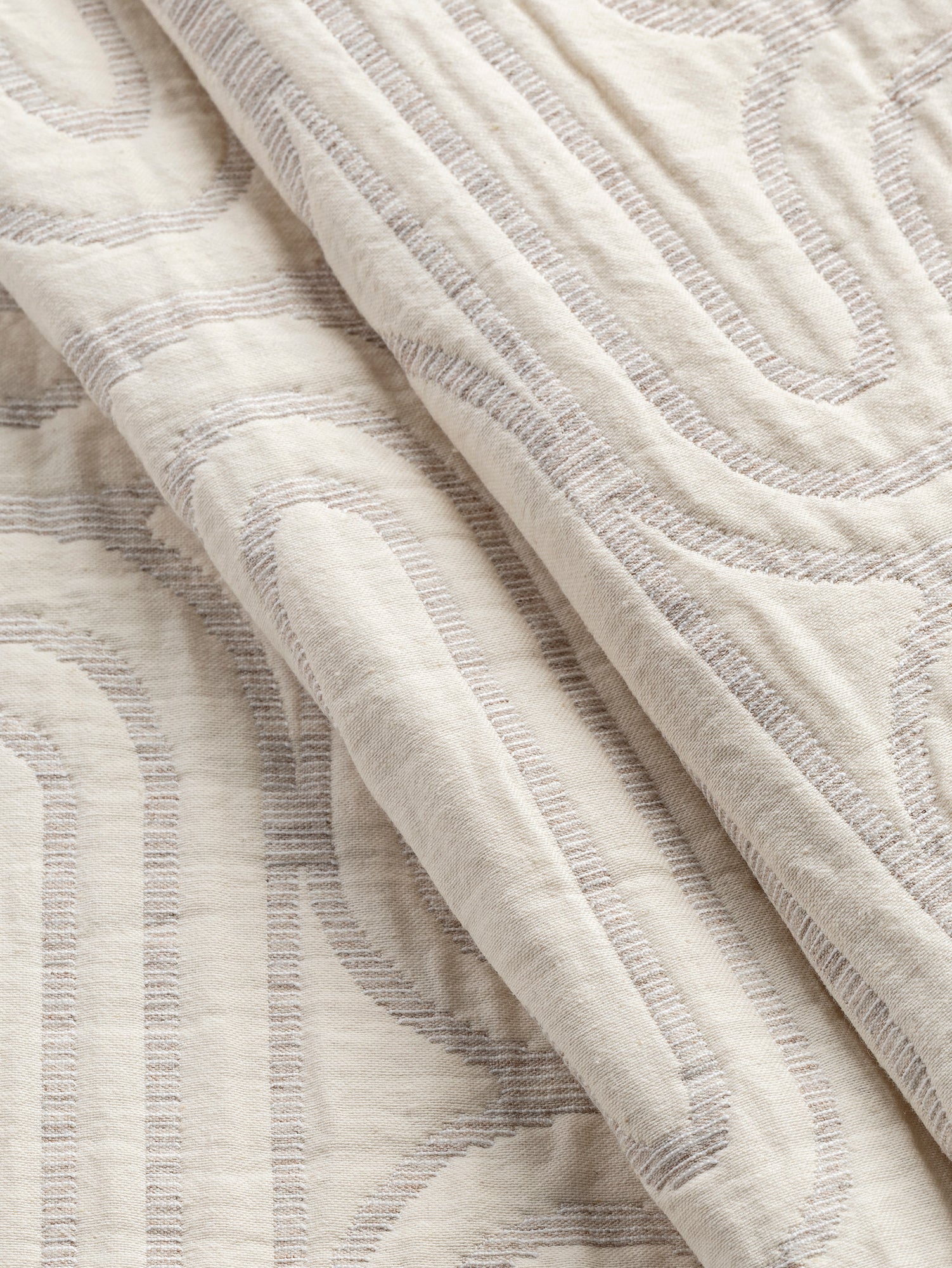 F-JAC026-Boho-Maze-Quilted-Jacquard-Almond-and-Cream-Core-Fabrics-fold.JPG