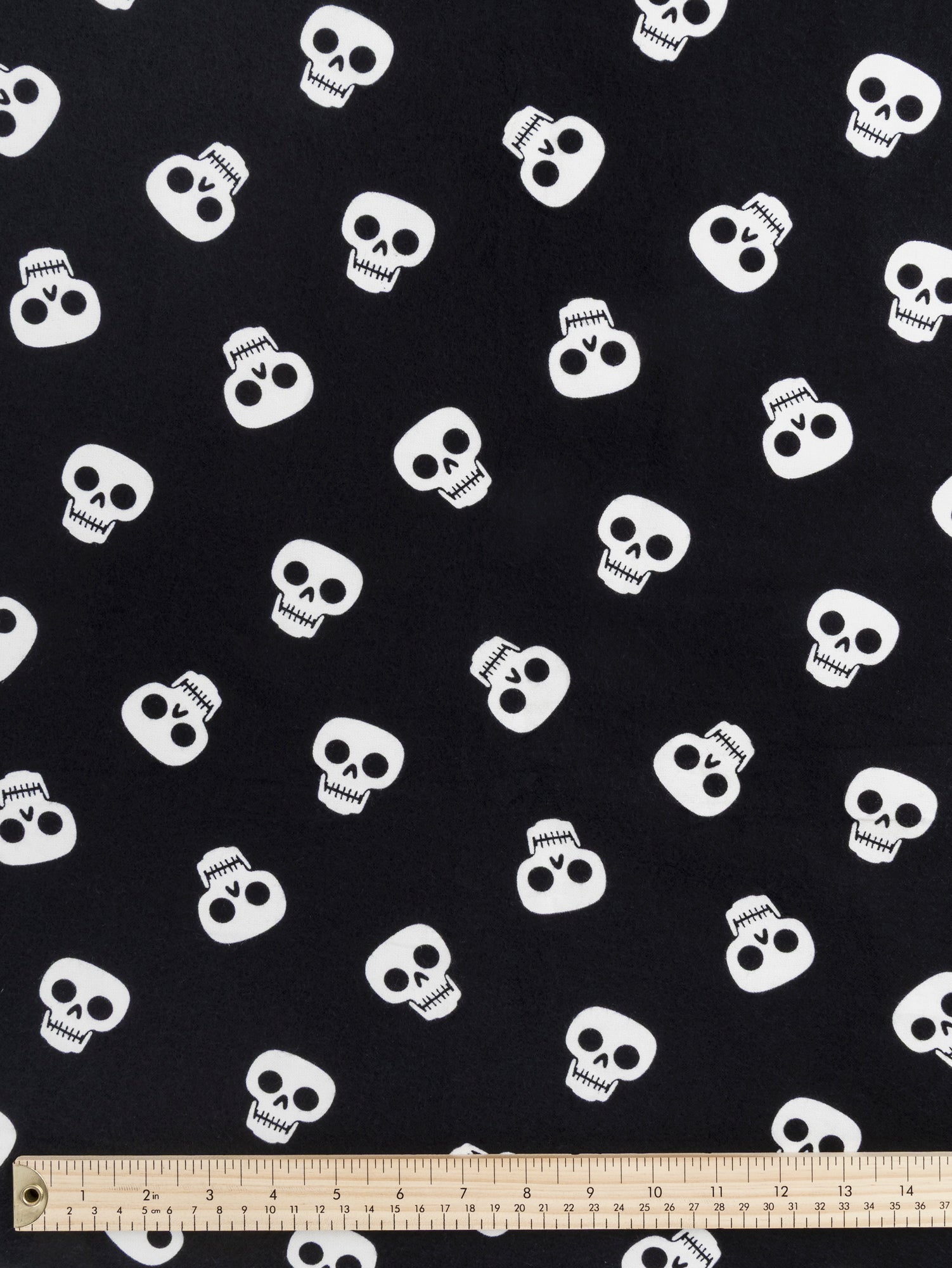 F-COT422 - Bone Chillin Skull Print Cotton Flannel Deadstock - Black + White - Core Fabrics- ruler.JPG
