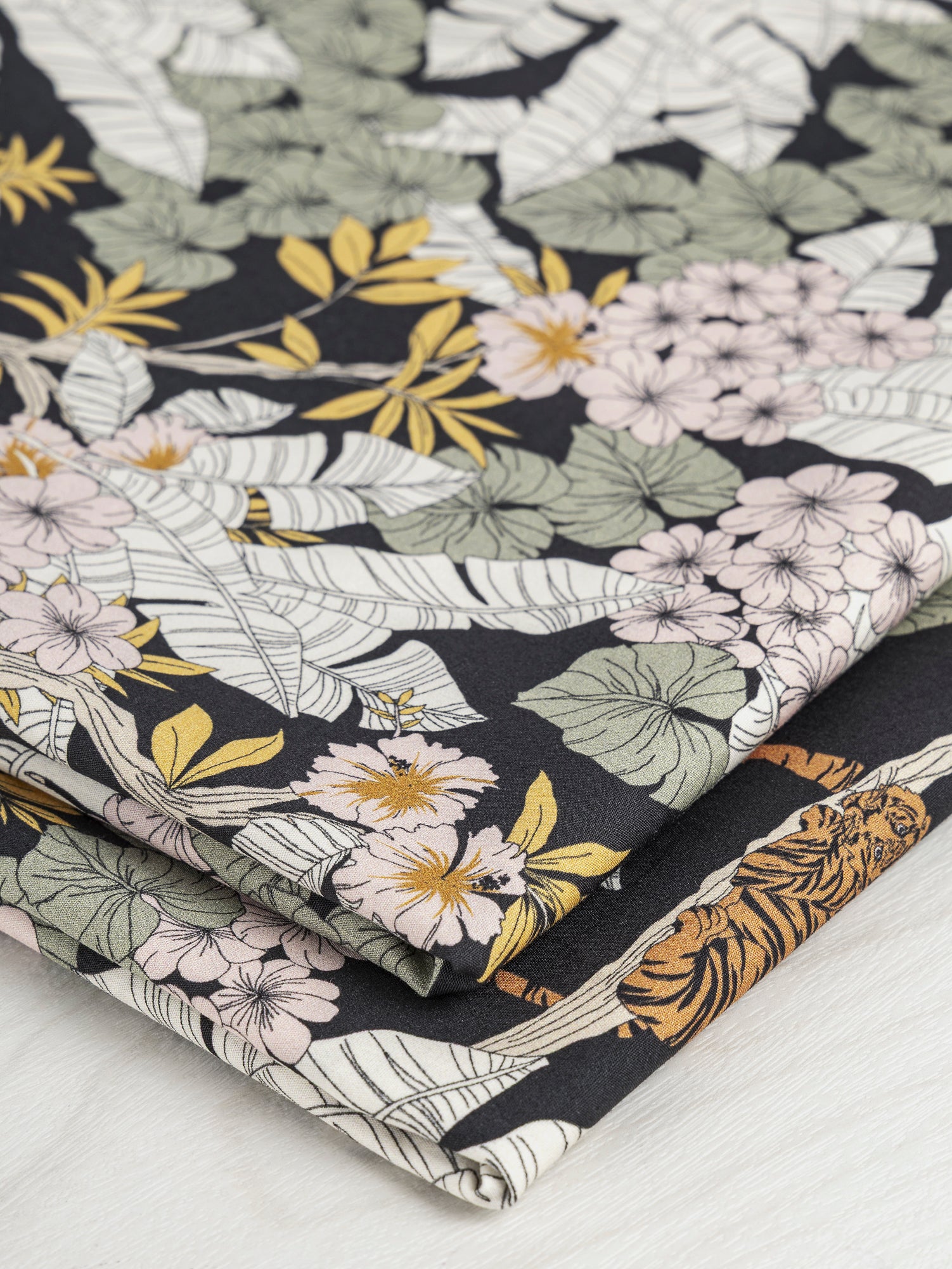 F-COT347-Botanical-Tile-Print-Ecovero-Viscose-Black-Teal-and-Cream-Core-Fabrics-fold.JPG