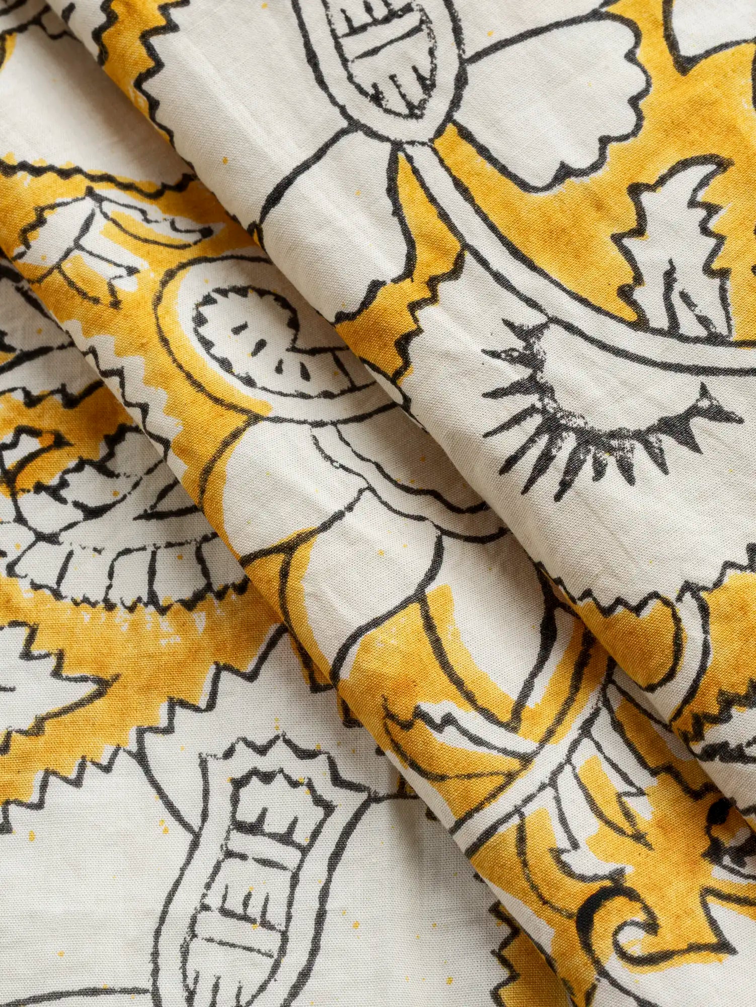 F-COT488-Boteh-Block-Print-Cotton-Poplin-Marigold-Oat-and-Black-Core-Fabrics-fold.webp