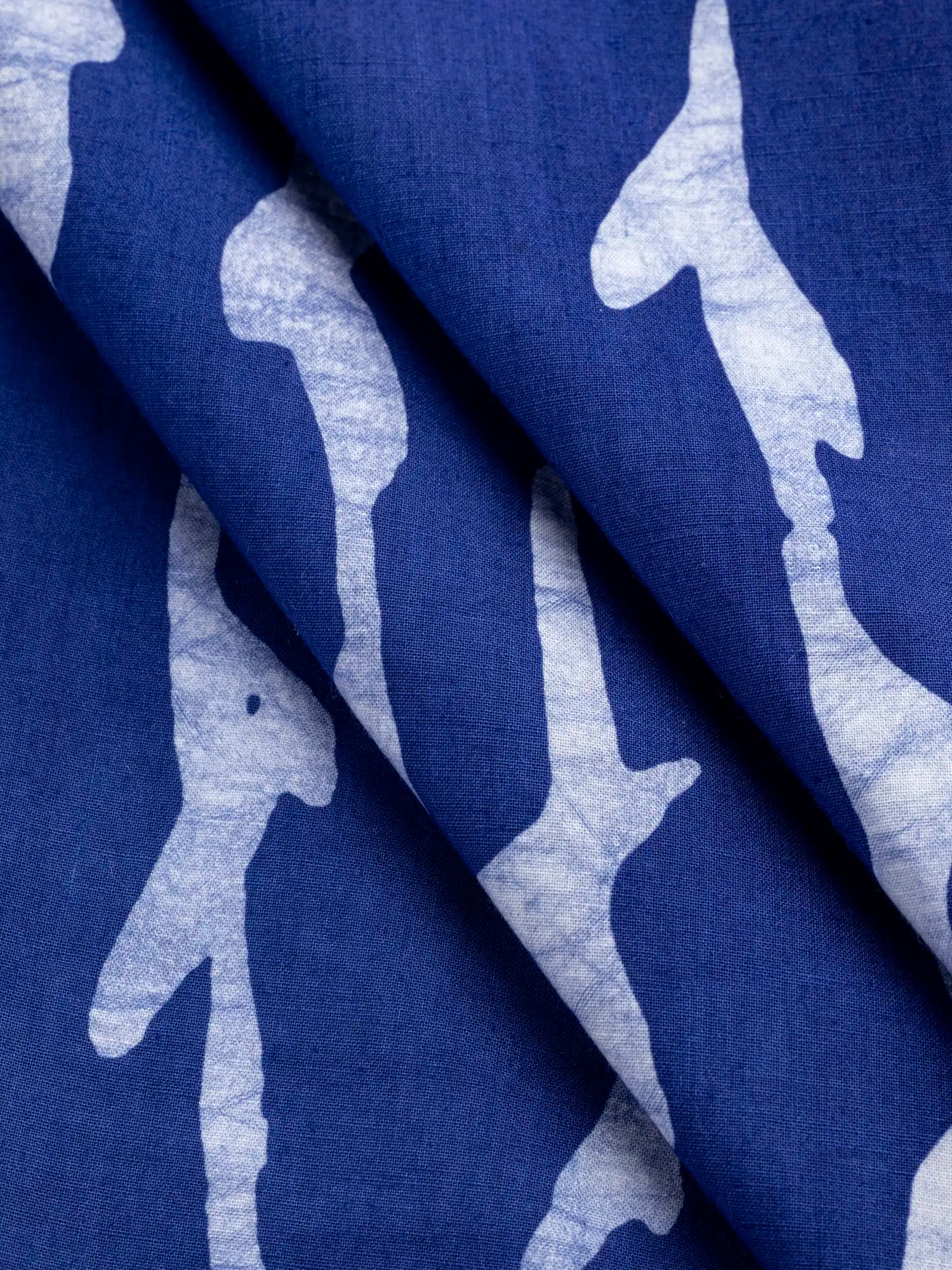 F-COT427-Branch-Artisanal-Cotton-Batik-Cobalt-Core-Fabrics-fold.webp