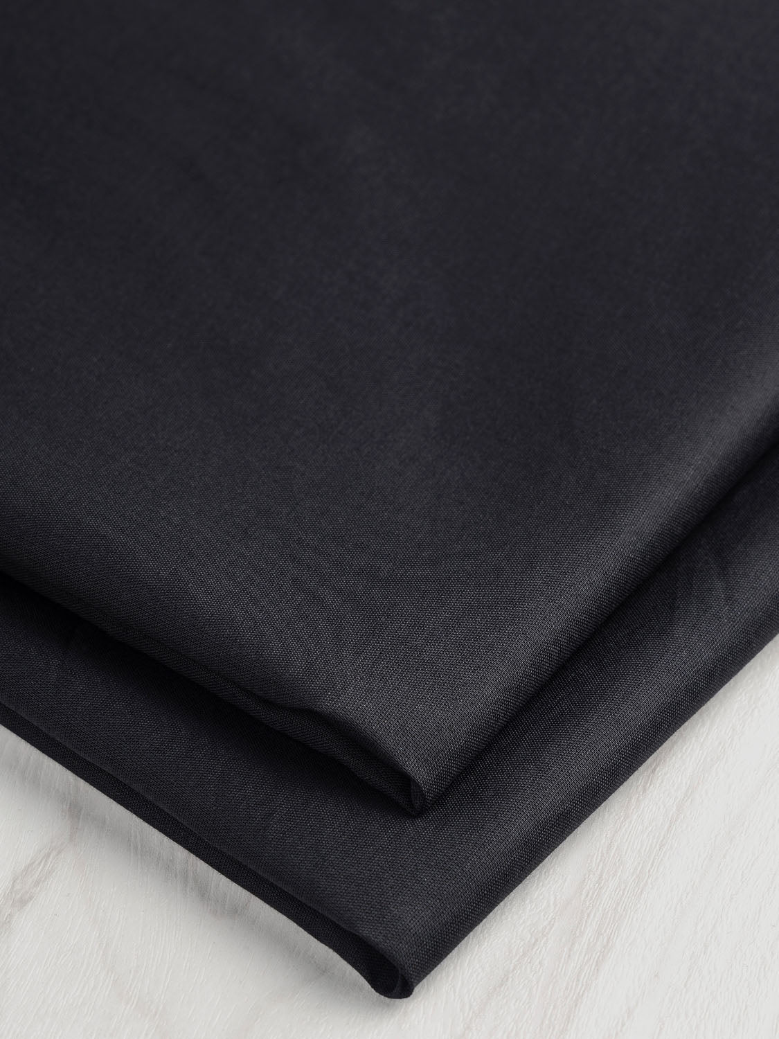 F-COT199-002-Organic-Cotton-Voile-Black-Core-Fabrics-fold