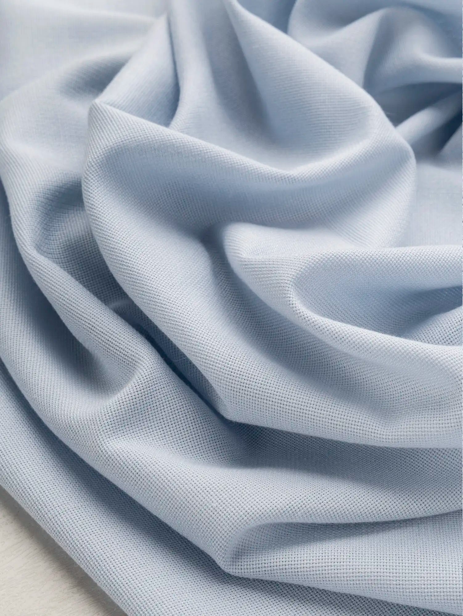 F-DEA217-Breezy-Poly-Viscose-Deadstock-Ice-Blue-Core-Fabrics-scrunched.webp