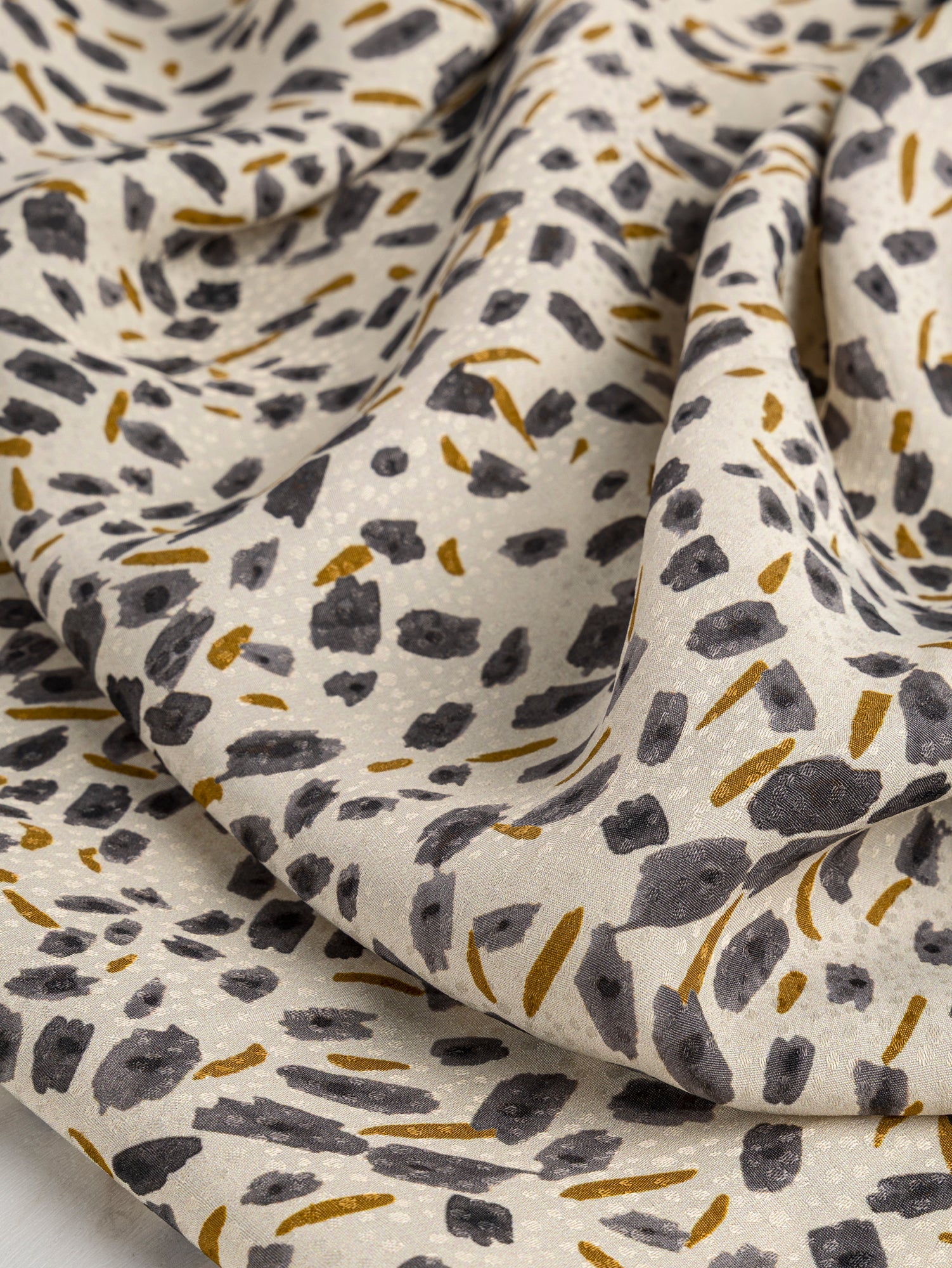 F-DEA029-Brush-Print-Viscose-Dobby-Deadstock-Cream-Steel-and-Ochre-Core-Fabrics-scrunched.JPG