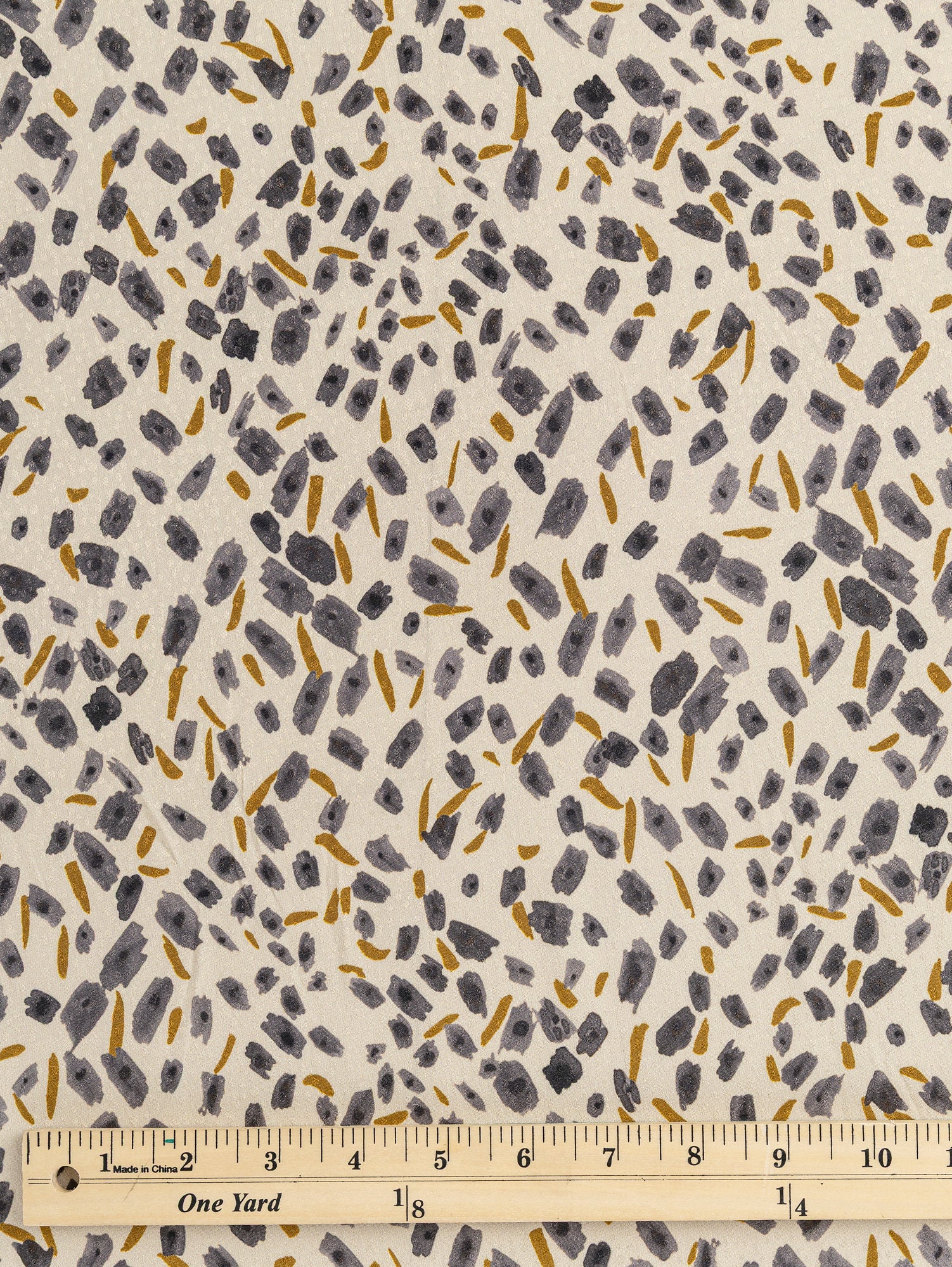 F-DEA029-Brush-Print-Viscose-Dobby-Deadstock-Cream-Steel-and-Ochre-Core-Fabrics-ruler.JPG