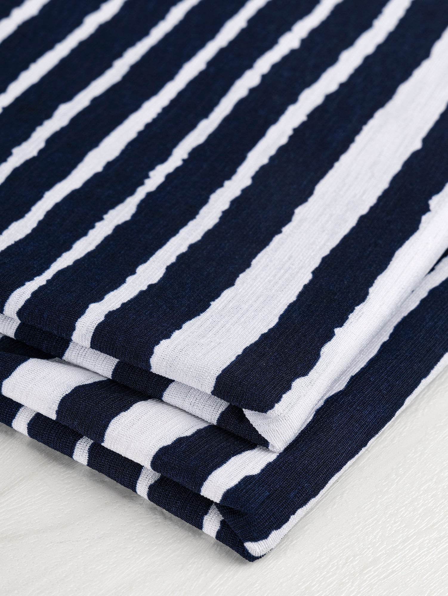 F-DEA024-Brush-Stripe-Poly-Stretch-Knit-Deadstock-Navy-and-White-Core-Fabrics-fold.JPG