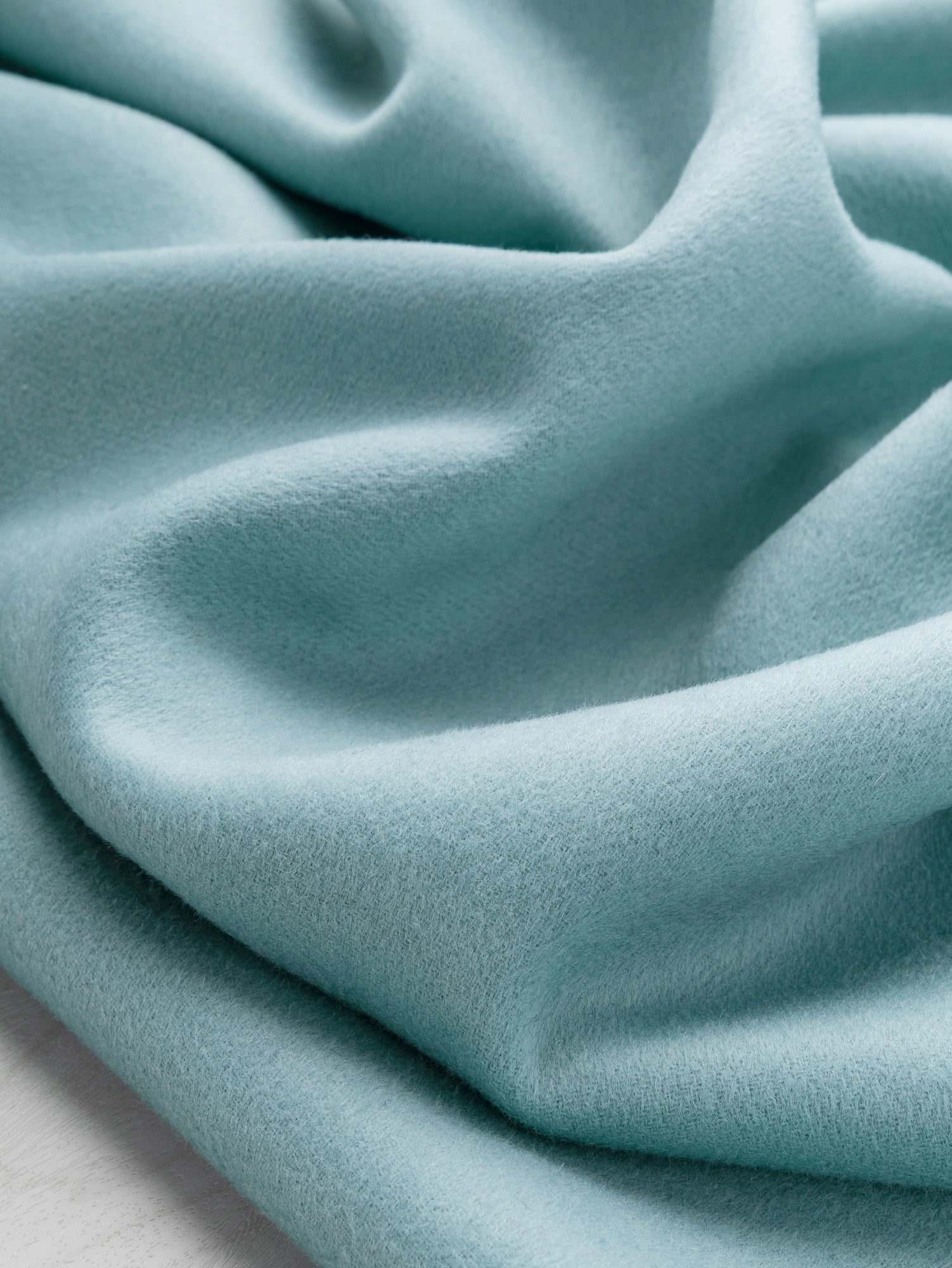 F-WOL143-Brushed-Melton-Wool-Blend-Deadstock-Light-Teal-Core-Fabrics-scrunched.JPG
